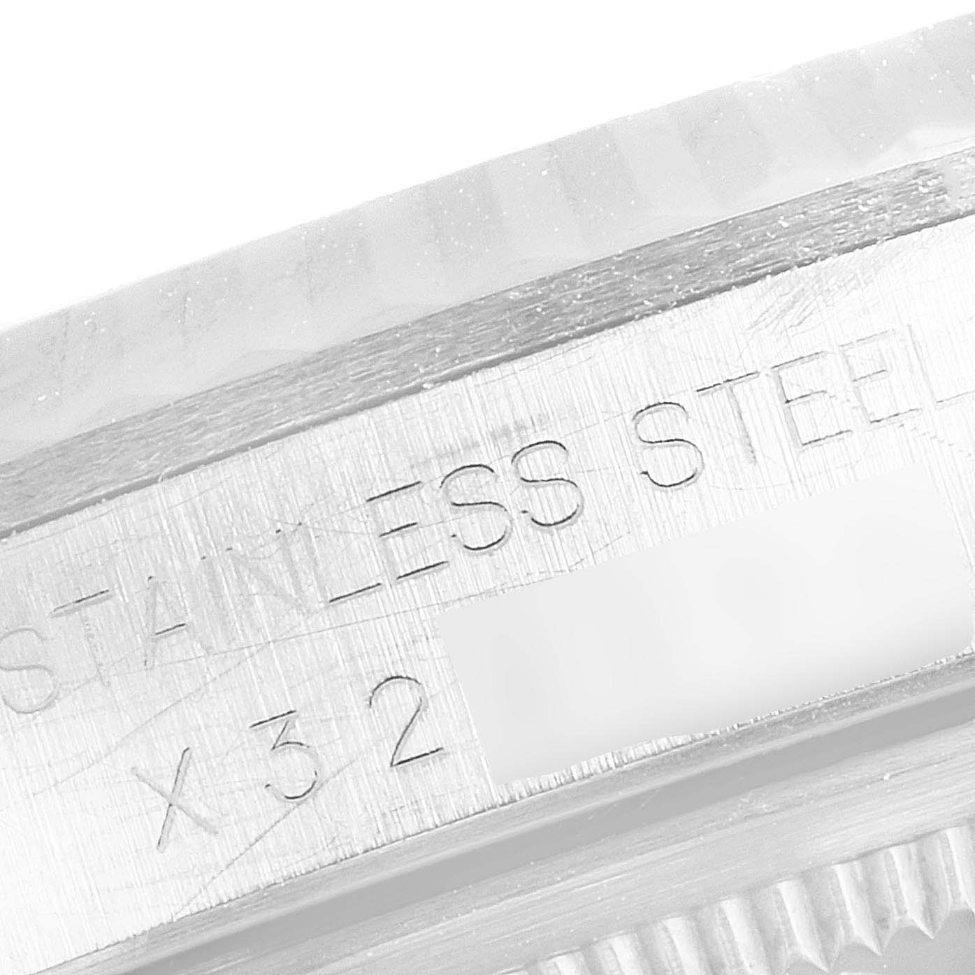 This image shows a close-up of the stainless steel case side and serial engraving of a Rolex Datejust 16234 Men's Stainless Steel Beige Dial 16234 Men's Stainless Steel Beige Dial watch.