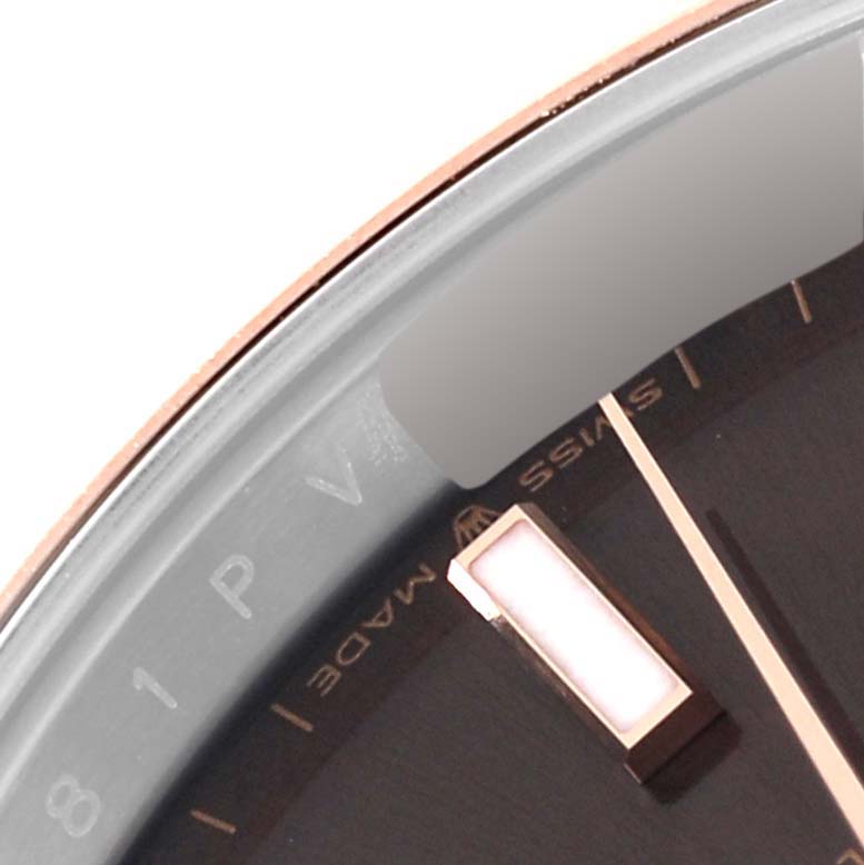 This image shows a close-up angle of the dial and part of the bezel of a Rolex Datejust 41 126301 Men's Steel and Gold (two tone) Brown Dial 126301 Men's Steel and Gold (two tone) Brown Dial watch, focusing on the markers and "Swiss Made" text.