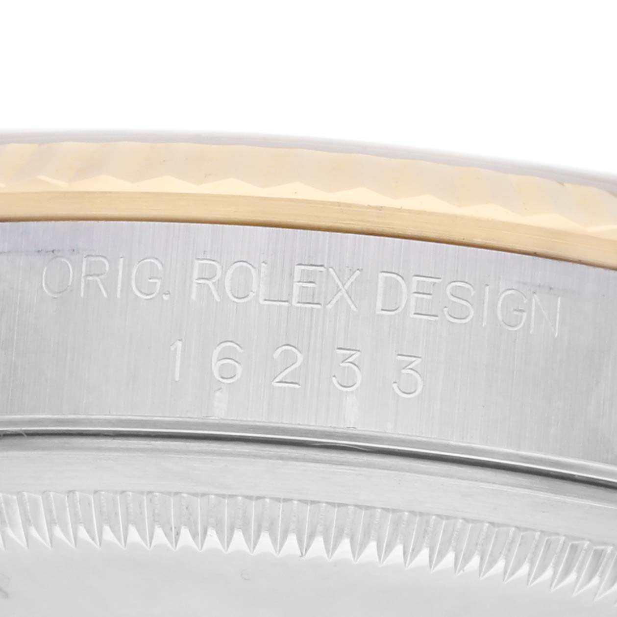 The image shows a close-up of the side of a Rolex Datejust 16233 Men
s Steel and Gold (two tone) Silver Dial watch case, with the model number "16233" engraved.