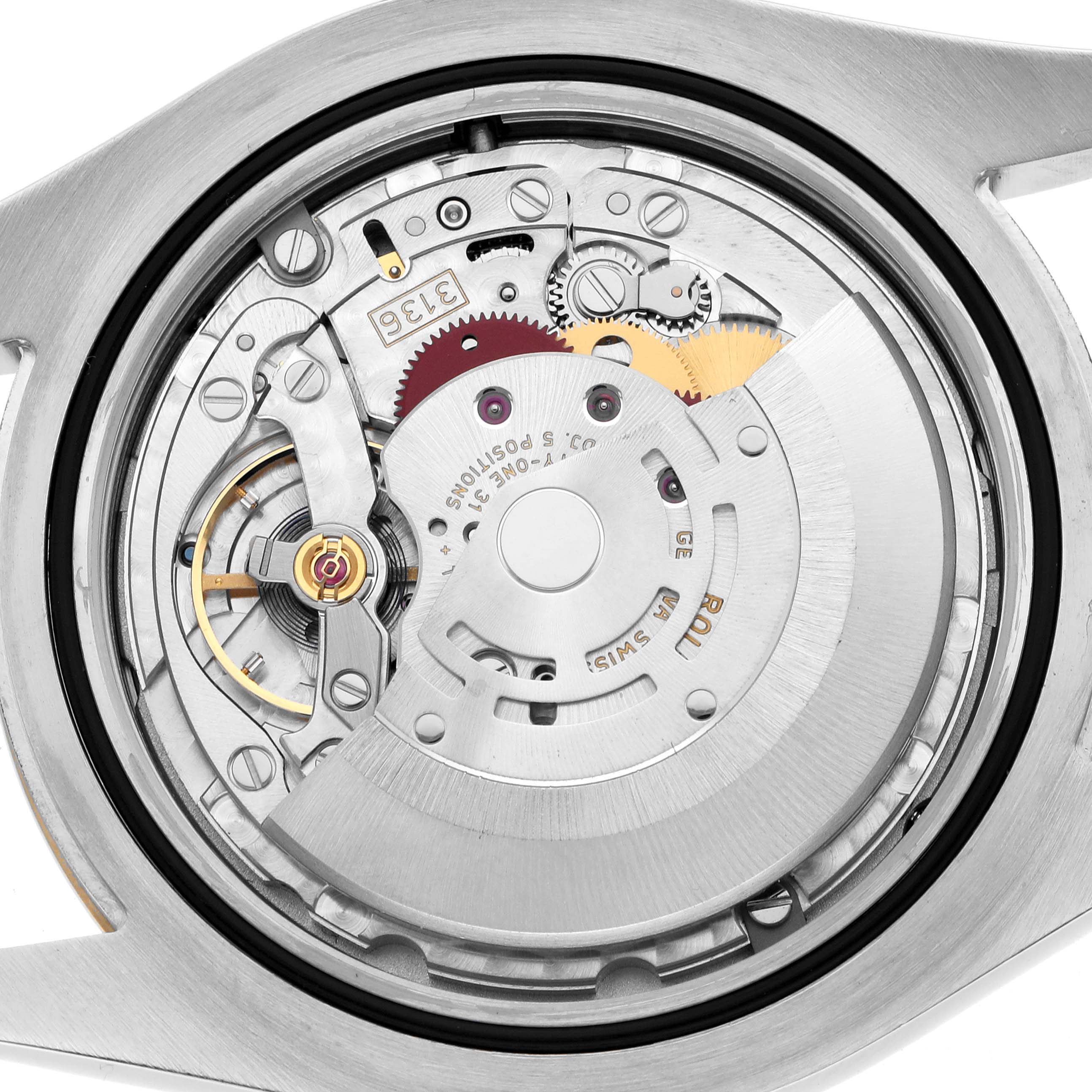 The image shows the internal movement of the Rolex Datejust 41 116333 Men
s Steel and Gold (two tone) Grey Dial, highlighting gears and the rotor from a rear angle.