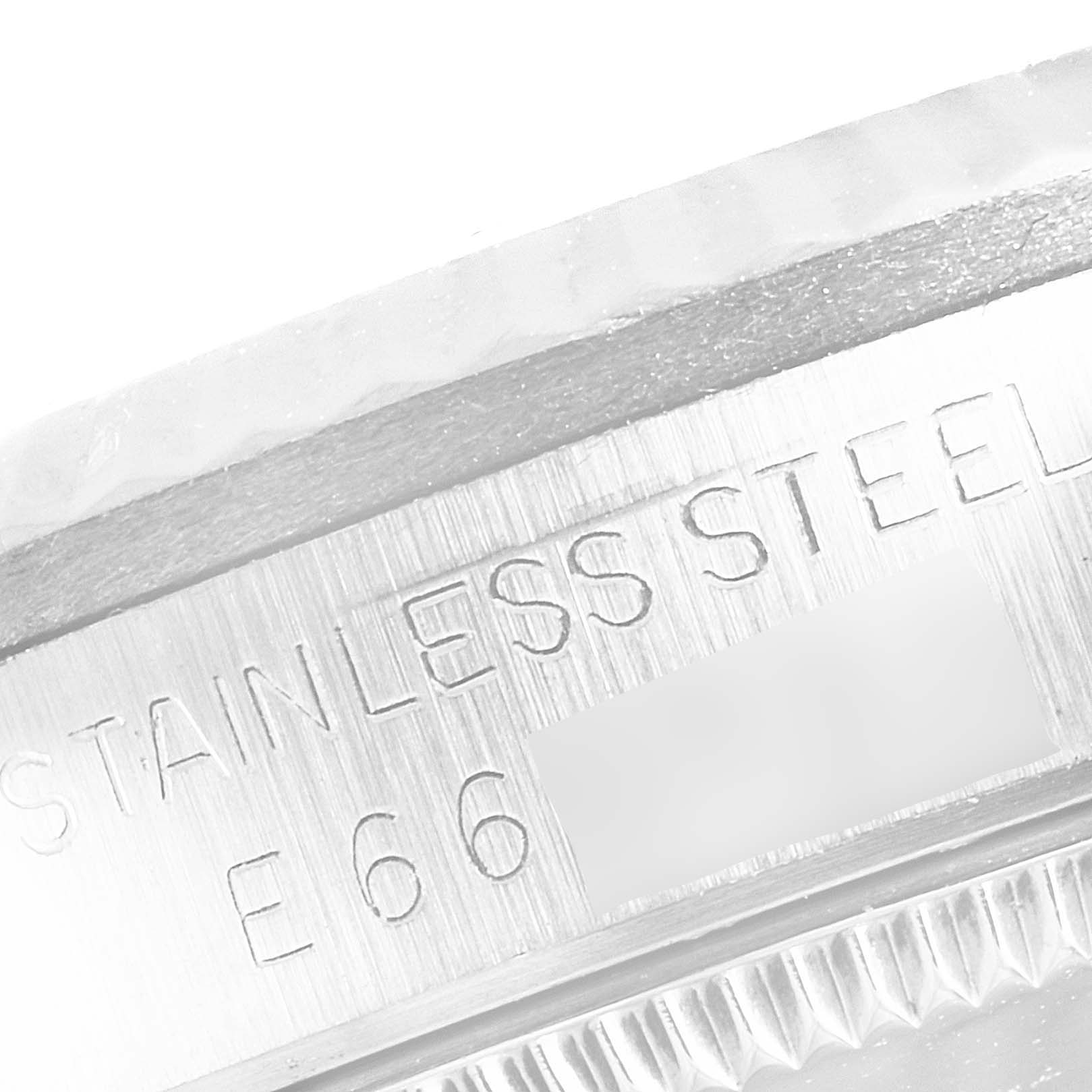 This is an extreme close-up of the marking on the side of a stainless steel Rolex Mid-Size 68274 Women's Stainless Steel Silver Dial 68274 Women's Stainless Steel Silver Dial watch case.