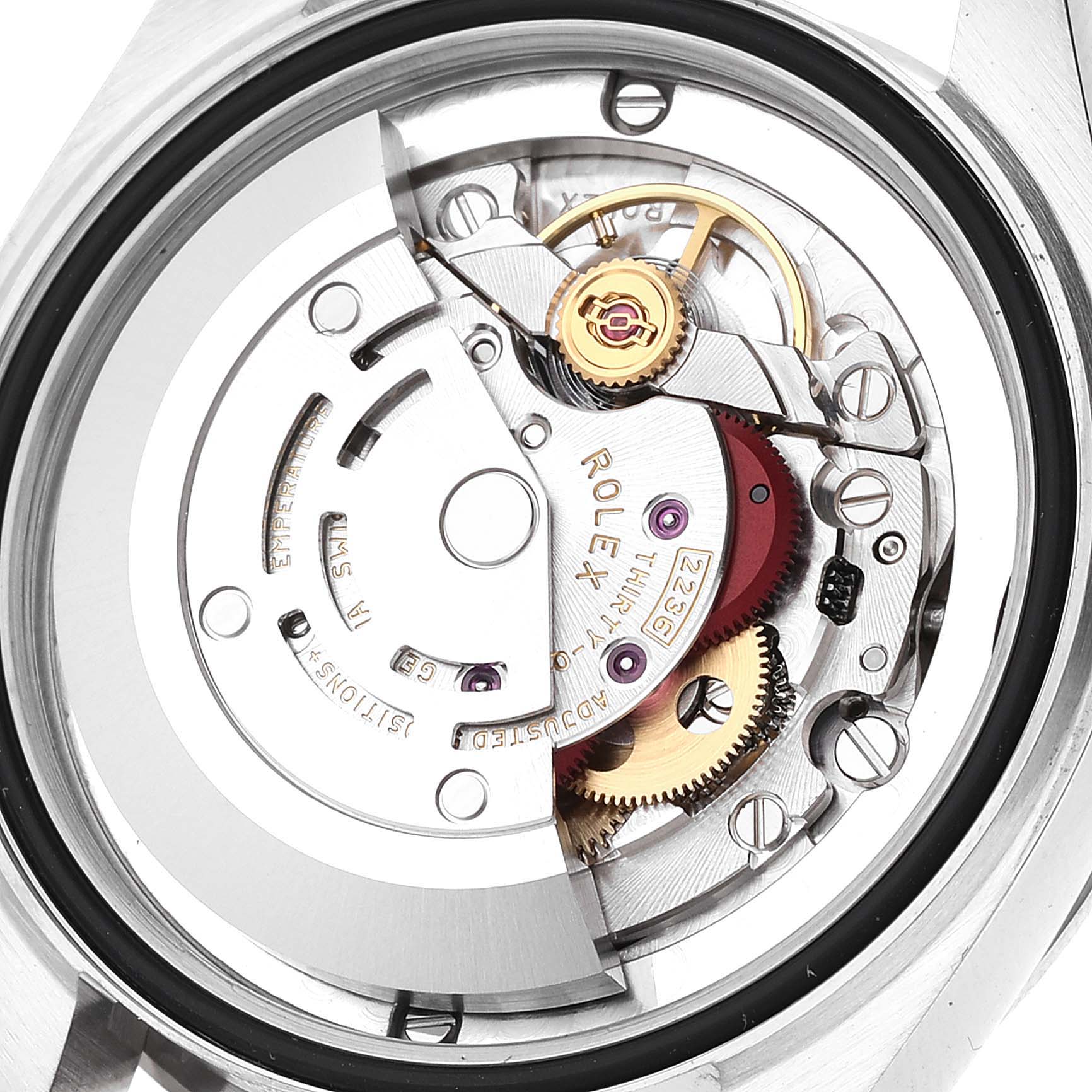 This image shows the internal mechanism of a mid-size Rolex watch viewed from the back, highlighting gears and other intricate parts.