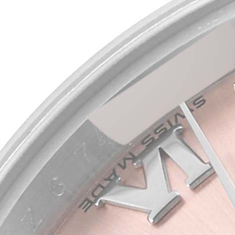 The image shows a close-up of the dial of a Rolex Datejust 179160 Women's Stainless Steel Pink Dial 179160 Women's Stainless Steel Pink Dial watch, specifically of the Roman numeral, Swiss Made text, and part of the date window.