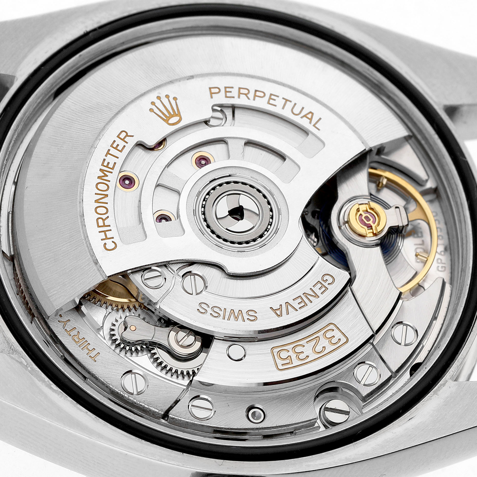 The image shows the movement of a Rolex Datejust 126234 Men's Stainless Steel Blue Dial watch, highlighting the intricate components from a close-up, back angle.