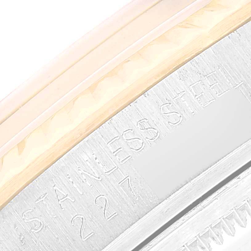 The image shows an angled close-up of the stainless steel case of a Vintage Collection model by Rolex.