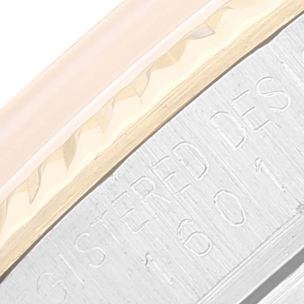 The image shows a close-up of the bezel and edge of the case for the Rolex Vintage Collection 1601 Men
s Steel and Gold (two tone) Champagne Dial 1601 Men
s Steel and Gold (two tone) Champagne Dial watch.