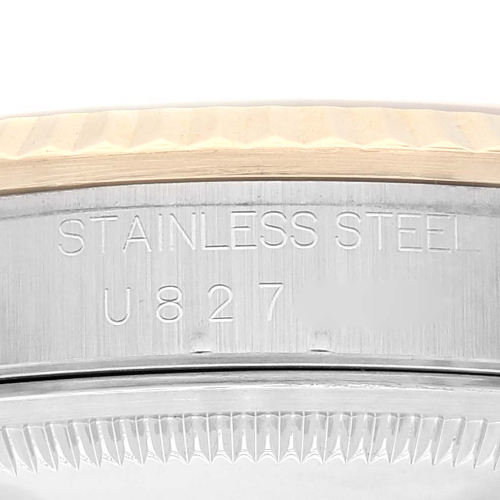 The image shows the side engraving of a Rolex Datejust 16233 Men's Steel and Gold (two tone) Champagne Dial 16233 Men's Steel and Gold (two tone) Champagne Dial watch case, highlighting the "STAINLESS STEEL" text and serial number U827.
