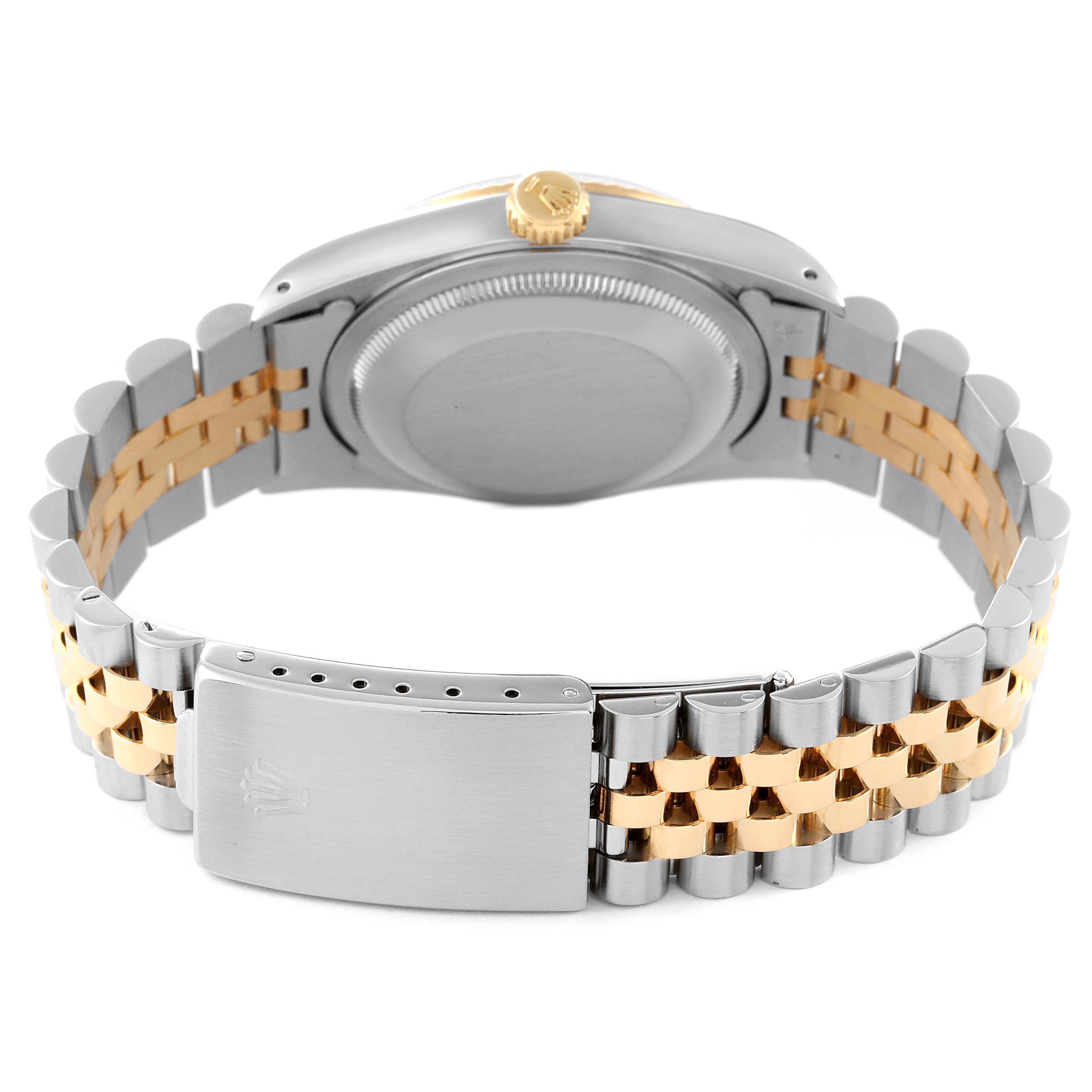 The back view of the Rolex Datejust 16233 Men's Steel and Gold (two tone) Champagne Dial 16233 Men's Steel and Gold (two tone) Champagne Dial watch displays the case back, crown, and the two-tone bracelet with a clasp.