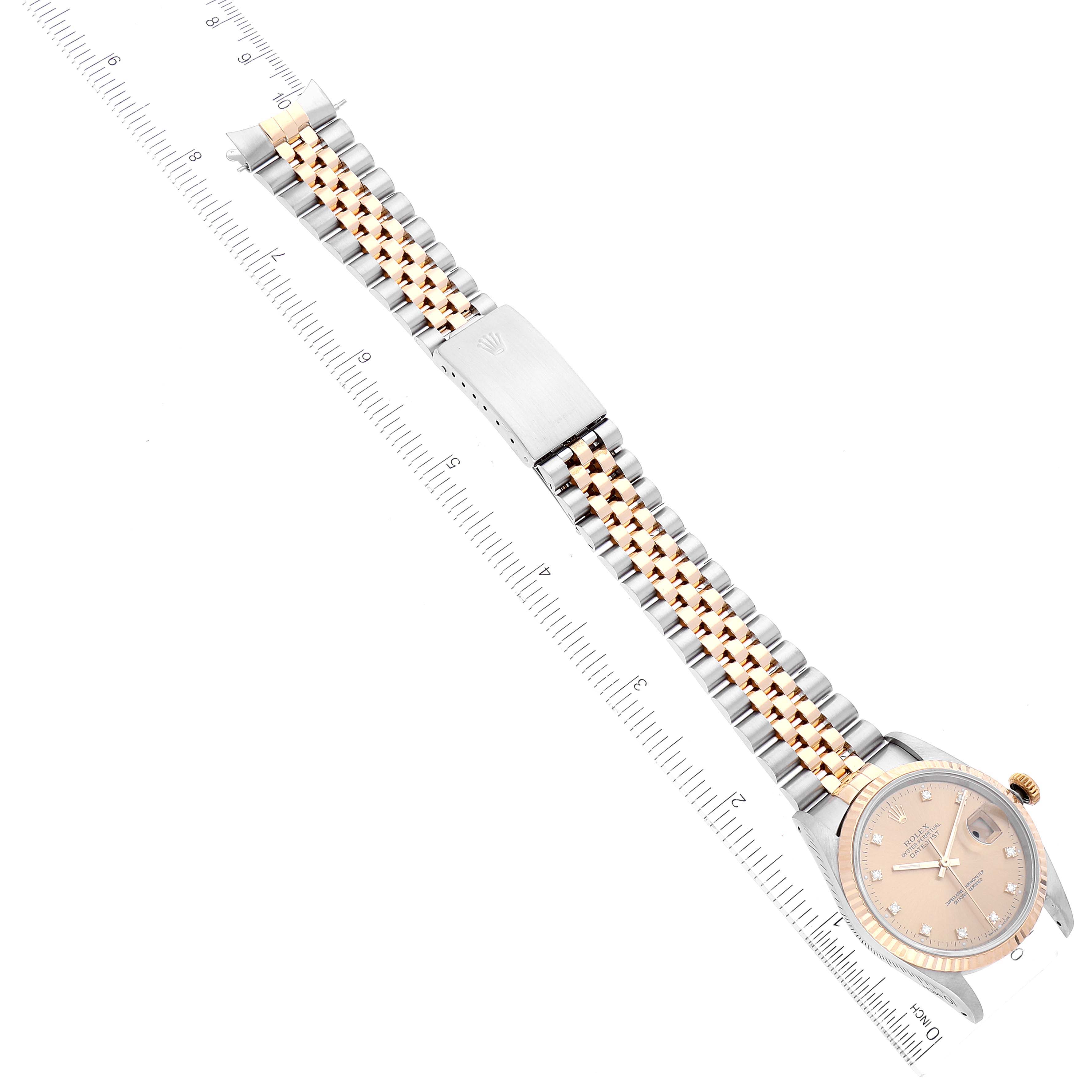 The image shows a top view of a Rolex Datejust 16233 Men's Steel and Gold (two tone) Champagne Dial 16233 Men's Steel and Gold (two tone) Champagne Dial watch including its case, dial, and two-tone bracelet with an extended clasp.