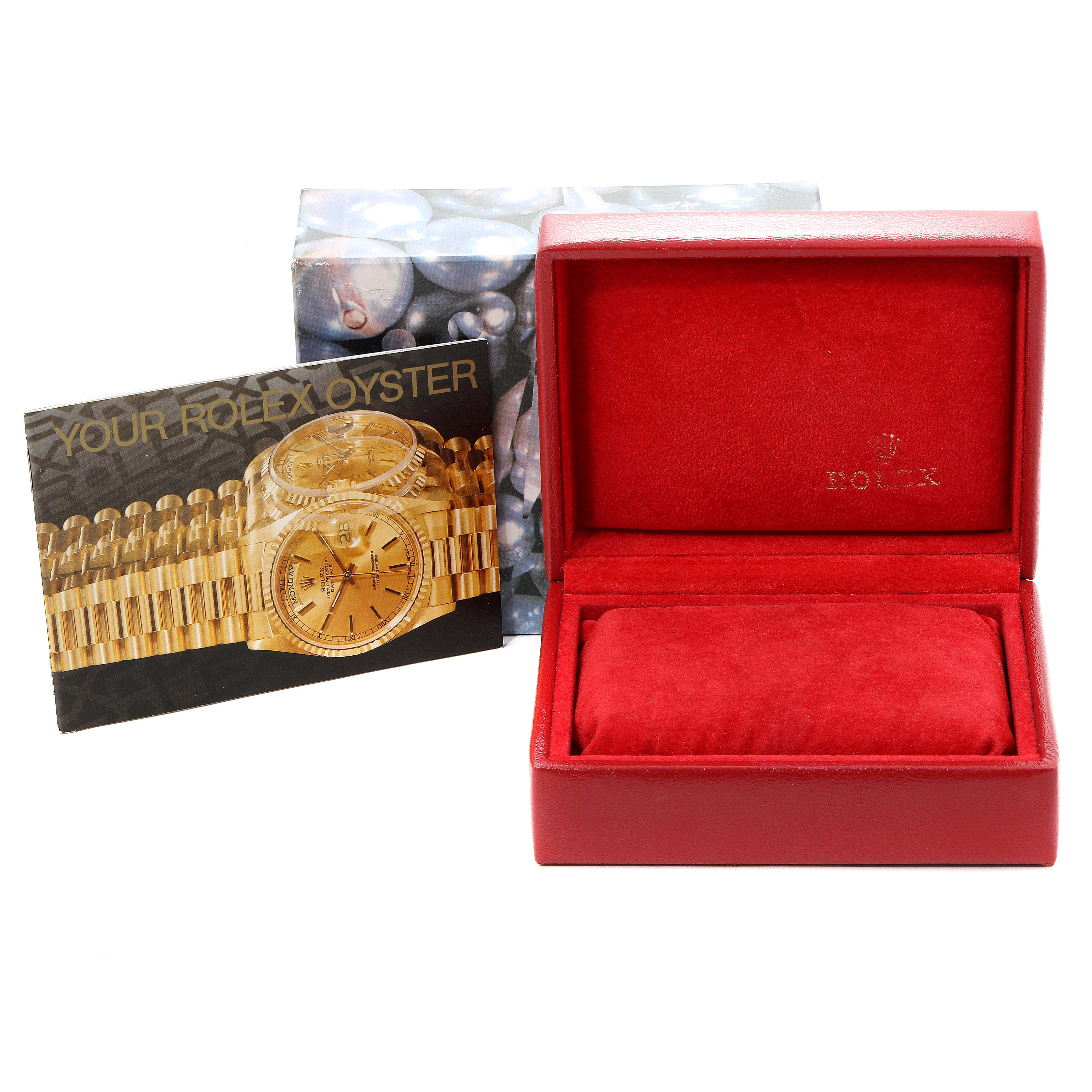 This image displays a Rolex Datejust 69173 Women's Steel and Gold (two tone) Champagne Dial 69173 Women's Steel and Gold (two tone) Champagne Dial watch brochure, a decorative box, and an empty red Rolex watch box.