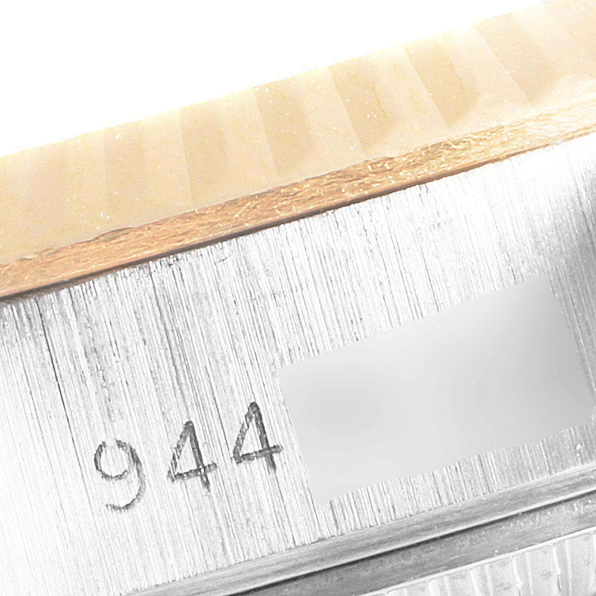 This image shows a close-up of the serial number engraving on the case side of a Rolex Datejust 69173 Women's Steel and Gold (two tone) Champagne Dial 69173 Women's Steel and Gold (two tone) Champagne Dial watch.