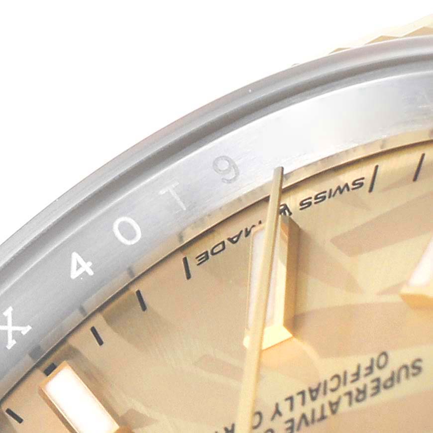 This image shows a close-up of the dial, bezel, and hands of a Rolex Datejust 126233 Men's Steel and Gold (two tone) Champagne Dial 126233 Men's Steel and Gold (two tone) Champagne Dial watch.