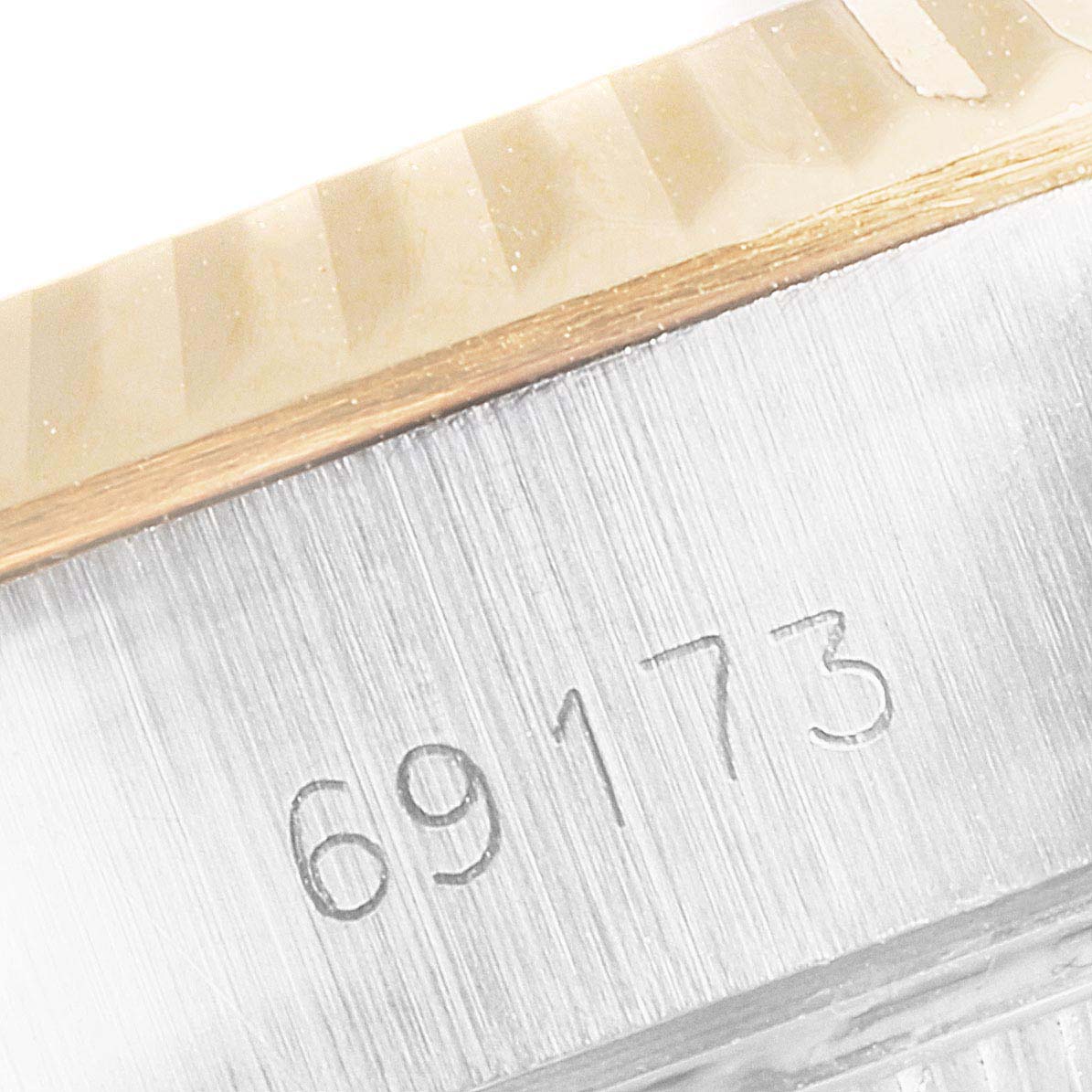 This image shows a close-up angle of the case side, bezel, and model number engraving (69173) of a Rolex Datejust 69173 Women's Steel and Gold (two tone) Champagne Dial 69173 Women's Steel and Gold (two tone) Champagne Dial watch.