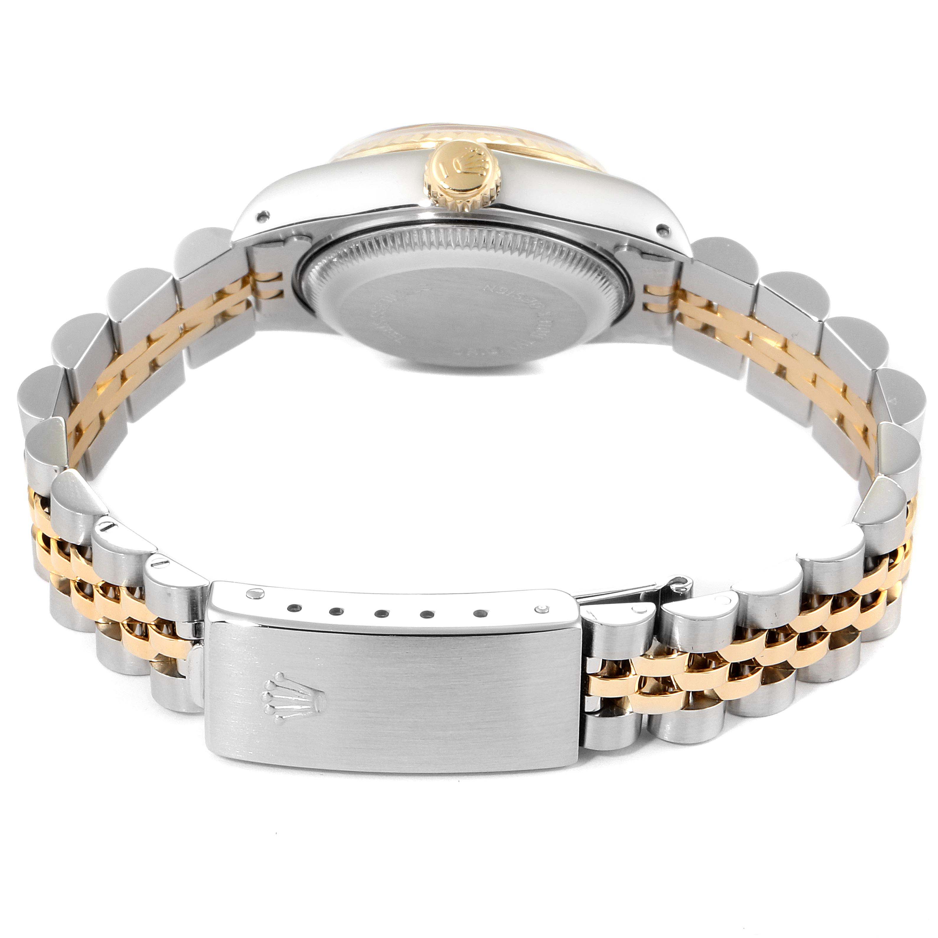 The image shows the Rolex Datejust 69173 Women's Steel and Gold (two tone) Champagne Dial 69173 Women's Steel and Gold (two tone) Champagne Dial watch from the side, highlighting the bracelet clasp, crown, and case back.