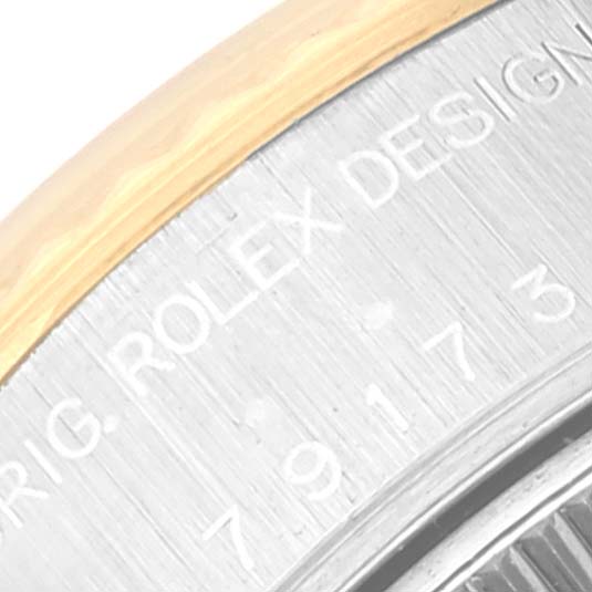 This close-up image displays part of the bezel and engraved side of a Rolex Datejust 79173 Women's Steel and Gold (two tone) Mother of Pearl Dial 79173 Women's Steel and Gold (two tone) Mother of Pearl Dial watch.