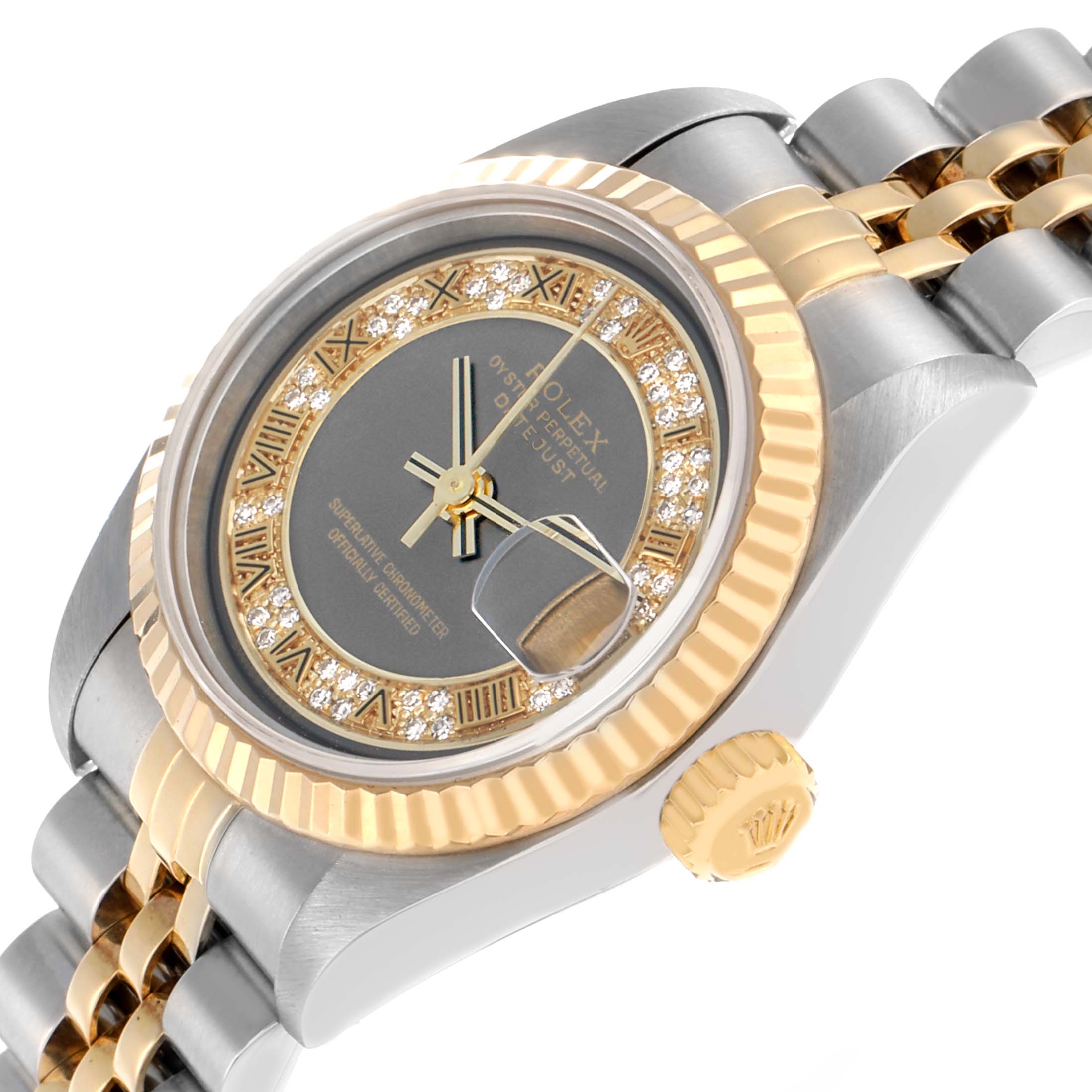 The Rolex Datejust 79173 Women
s Steel and Gold (two tone) Grey Dial watch is shown at an oblique angle highlighting the bezel, crown, and part of the bracelet.