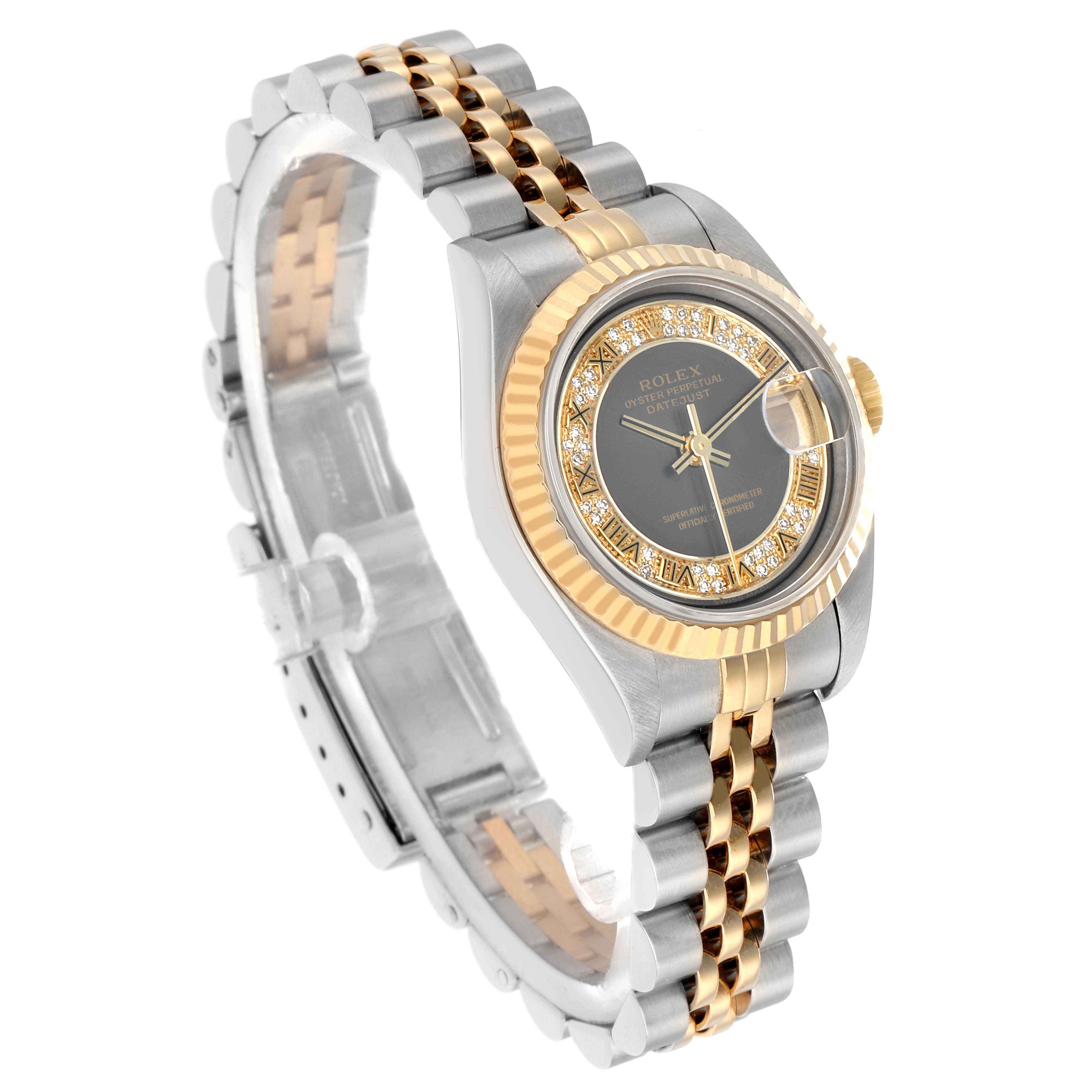 The Rolex Datejust 79173 Women
s Steel and Gold (two tone) Grey Dial watch is shown at a 3/4 angle highlighting the gold bezel, dial, jubilee bracelet, and date window.