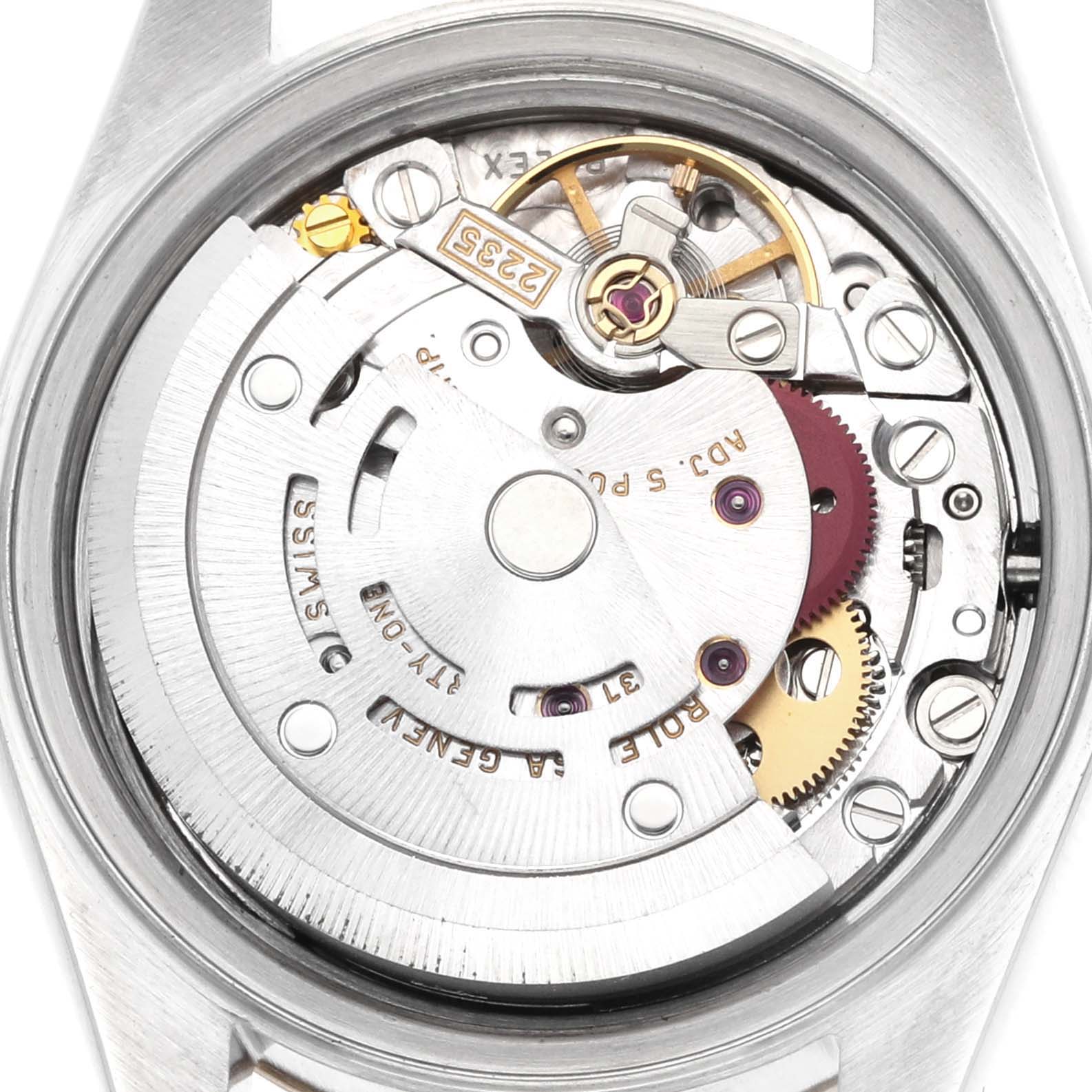 The image shows the movement of a Rolex Datejust 79173 Women
s Steel and Gold (two tone) Grey Dial watch from a top-down angle, highlighting its internal mechanics.