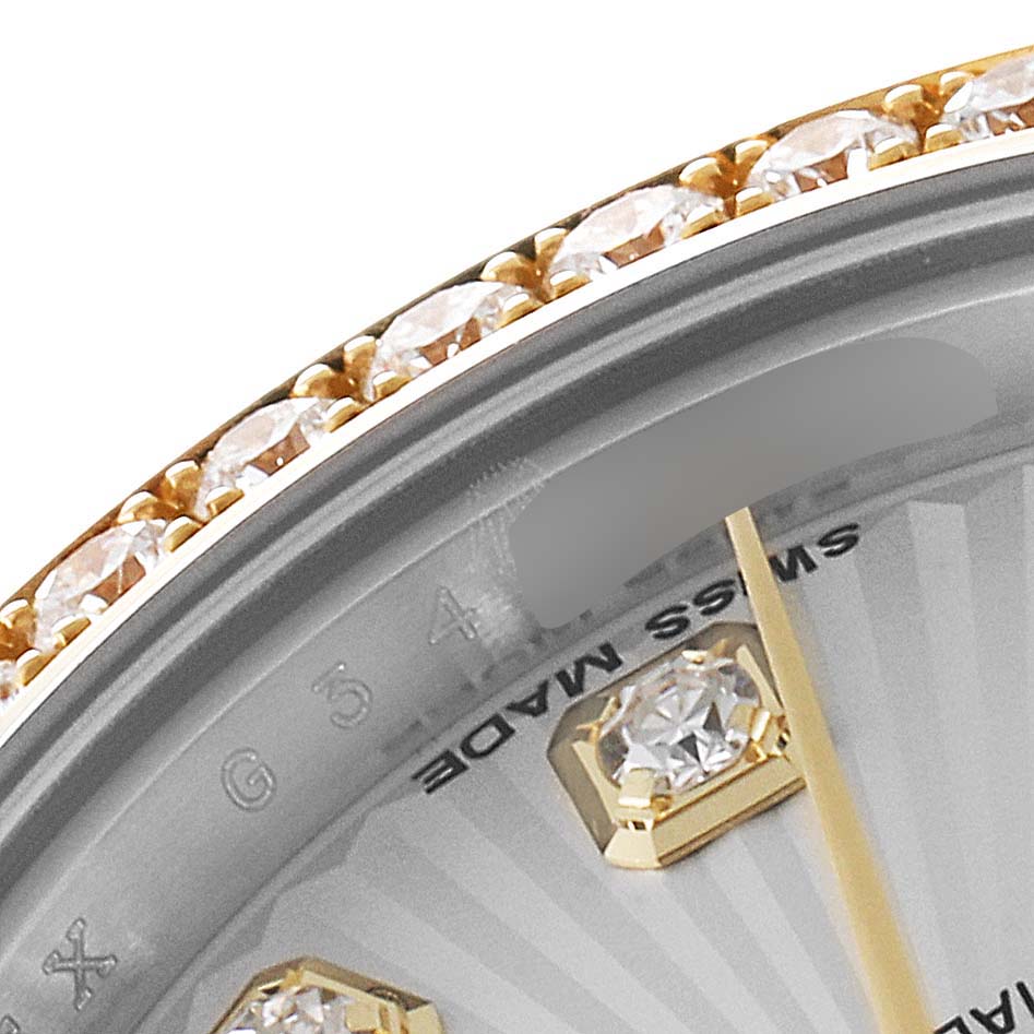 This close-up image shows the dial, bezel, and part of the indices of the Rolex Datejust 179383 Women
s Steel and Gold (two tone) Silver Dial 179383 Women
s Steel and Gold (two tone) Silver Dial watch.