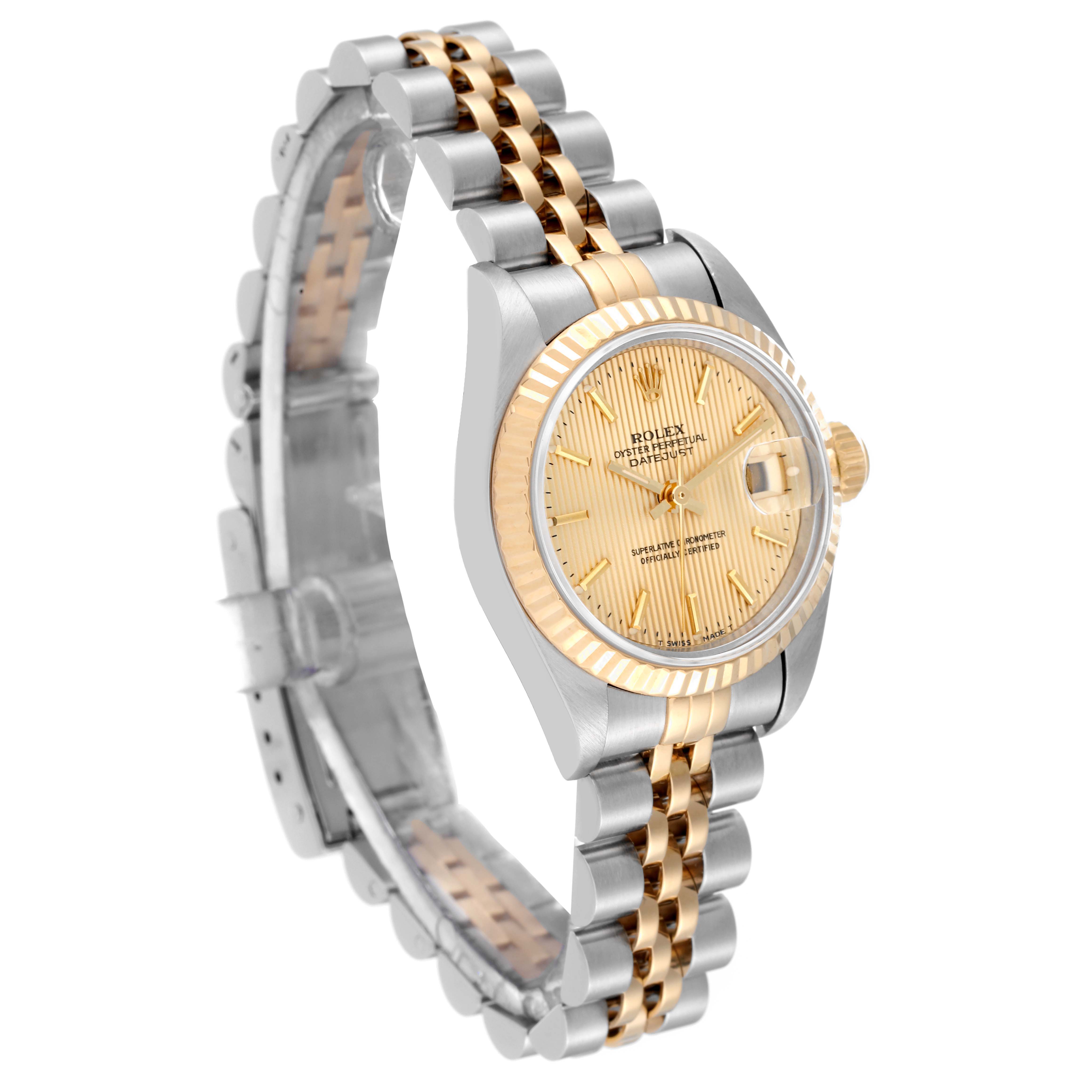 This is a Rolex Datejust 69173 Women's Steel and Gold (two tone) Champagne Dial 69173 Women's Steel and Gold (two tone) Champagne Dial watch angled to show the face, bezel, and two-tone bracelet.