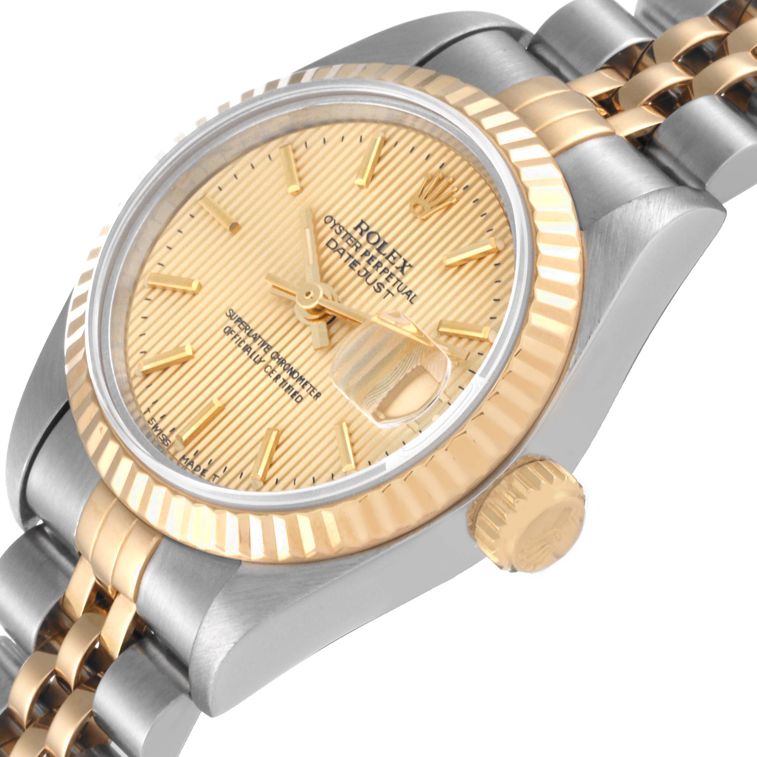 This image shows a close-up, angled view of the dial, bezel, crown, and part of the bracelet of a Rolex Datejust 69173 Women's Steel and Gold (two tone) Champagne Dial 69173 Women's Steel and Gold (two tone) Champagne Dial watch.