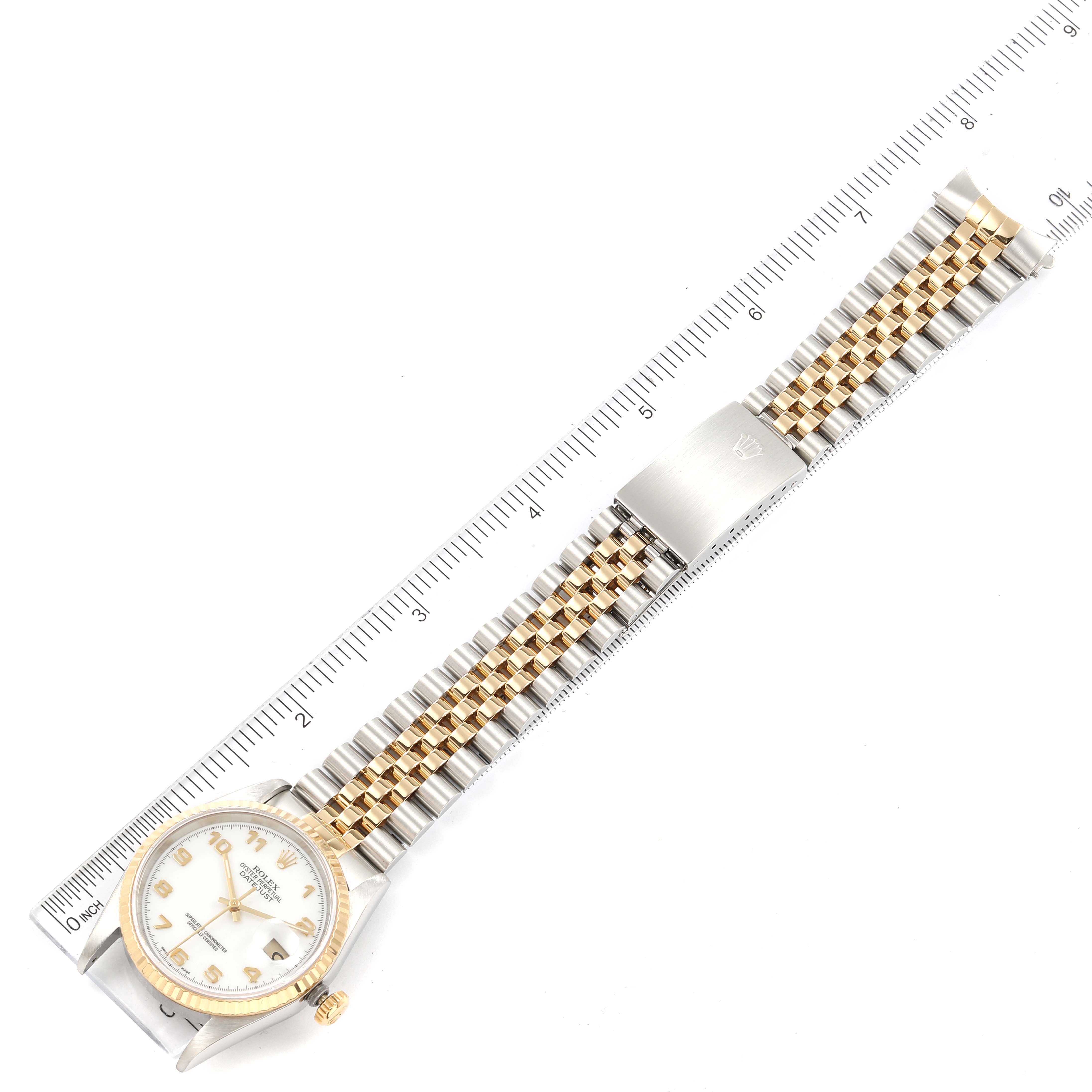 This image shows a top-down view of a Rolex Datejust 16233 Men's Steel and Gold (two tone) White Dial 16233 Men's Steel and Gold (two tone) White Dial watch, prominently displaying its face, crown, clasp, and bracelet.
