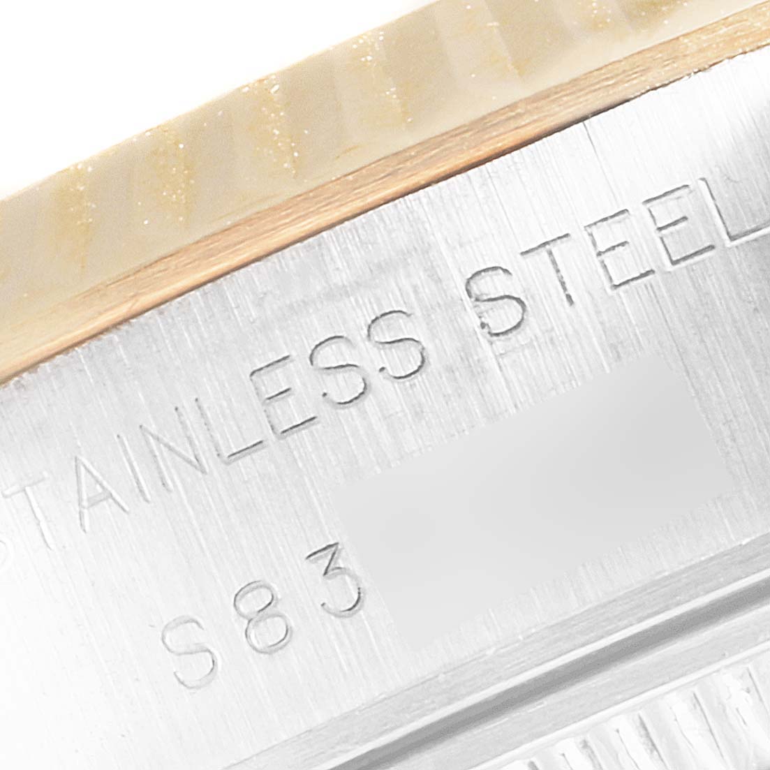 This image shows a close-up of the stainless steel case back of a Rolex Datejust 69173 Women's Steel and Gold (two tone) White Dial 69173 Women's Steel and Gold (two tone) White Dial model.