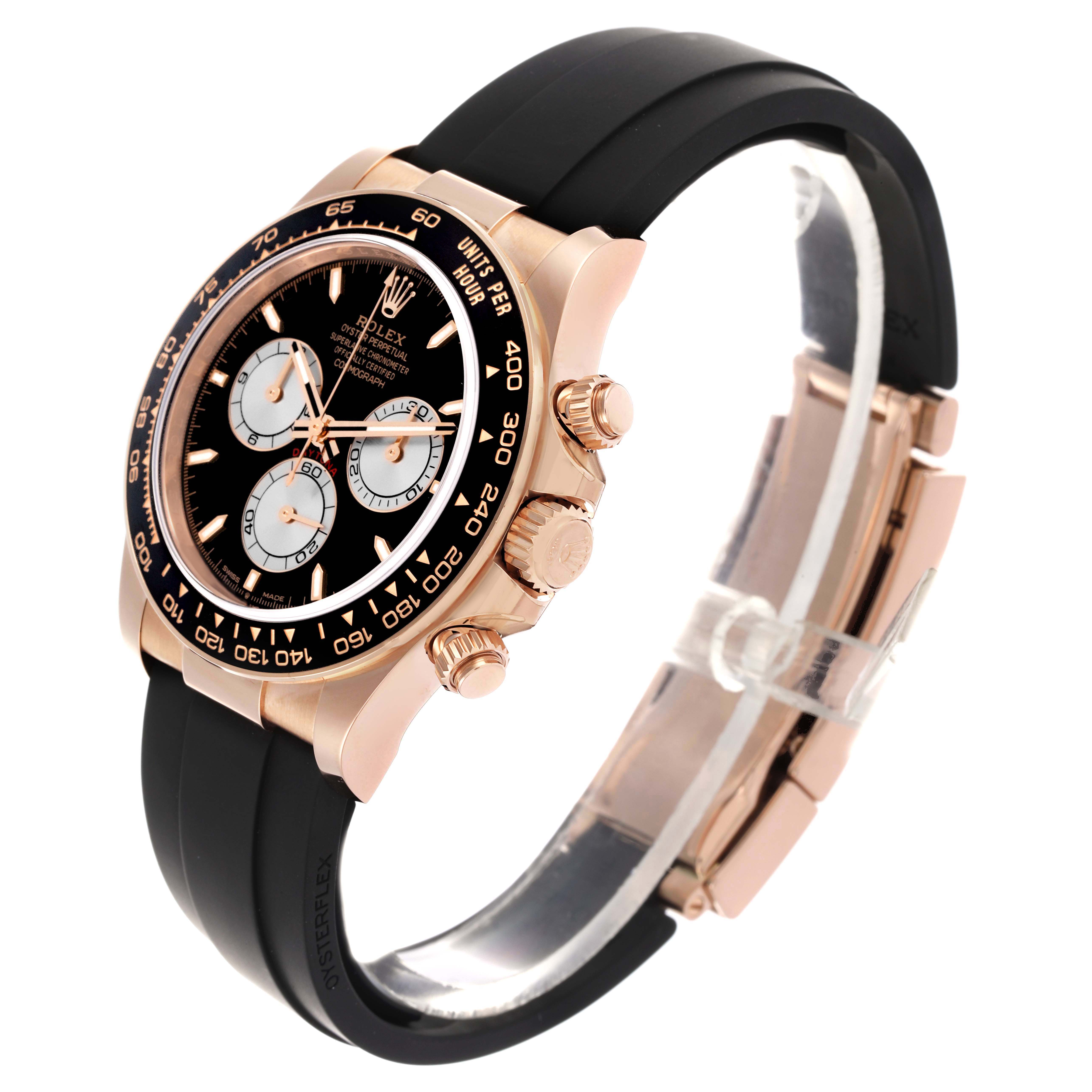 The Rolex Daytona 126515 Men
s Rose Gold Black Dial watch is shown from a front-side angle, highlighting the face, bezel, case, pushers, and band.
