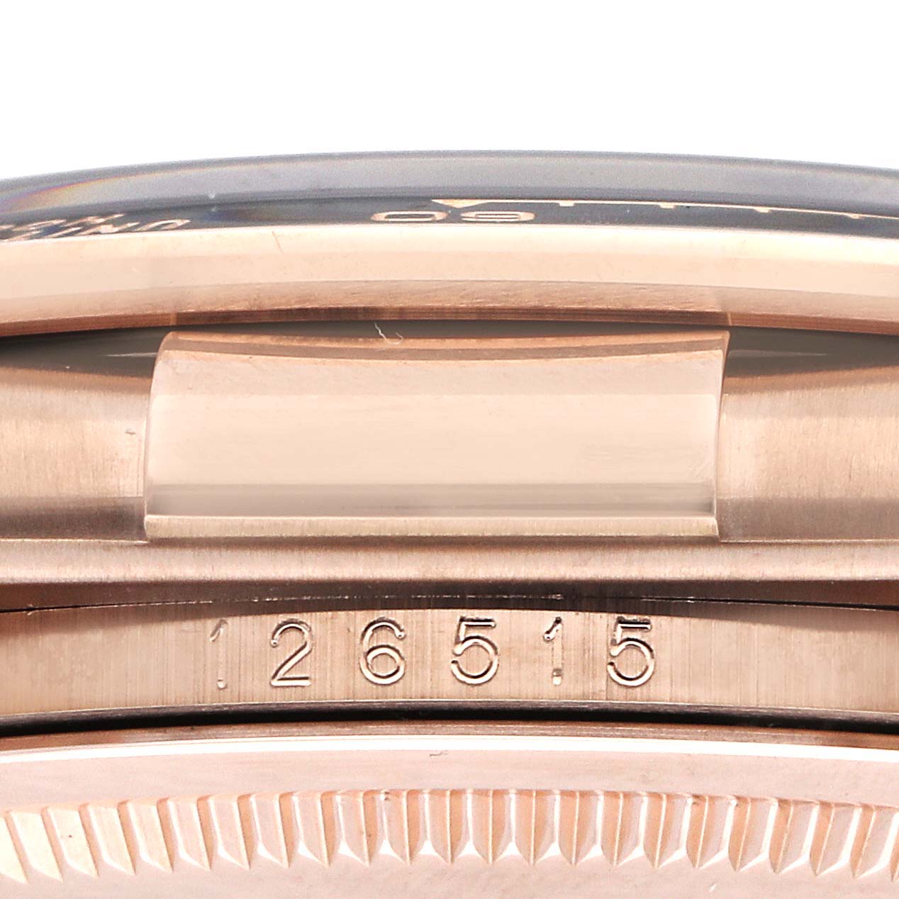 The image shows a close-up side view of a Rolex Daytona 126515 Men
s Rose Gold Black Dial case, focusing on the model number engraved on its side.