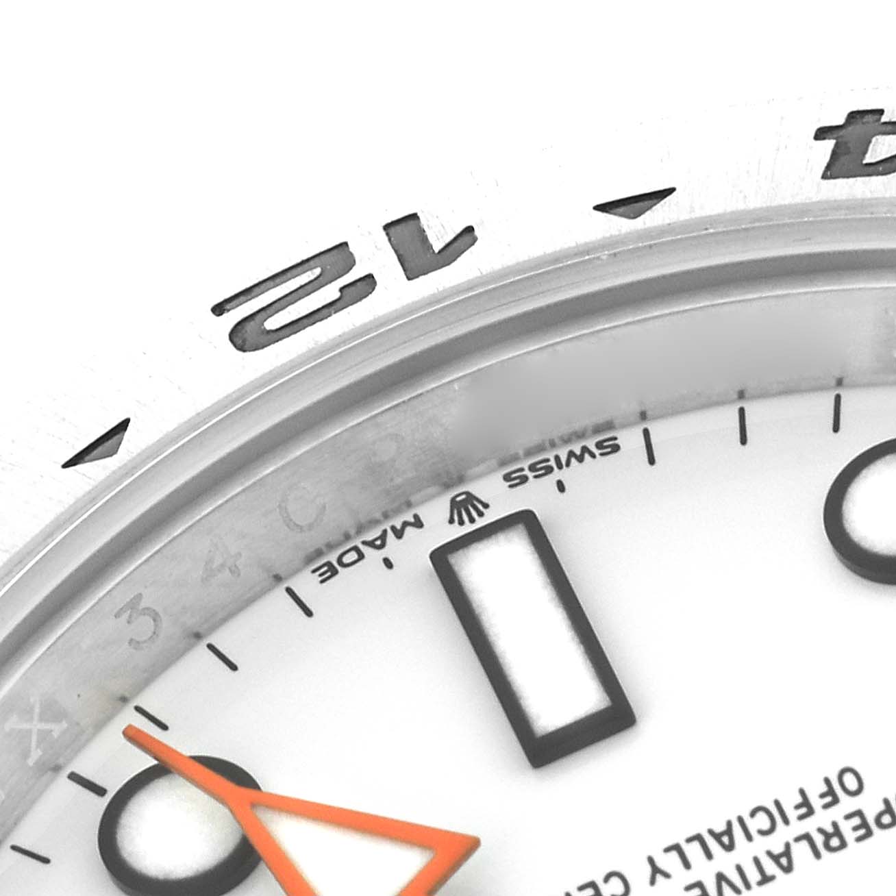 This close-up image of a Rolex Explorer 226570 Men
s Stainless Steel White Dial 226570 Men
s Stainless Steel White Dial watch shows part of the bezel, dial, and hour hand.