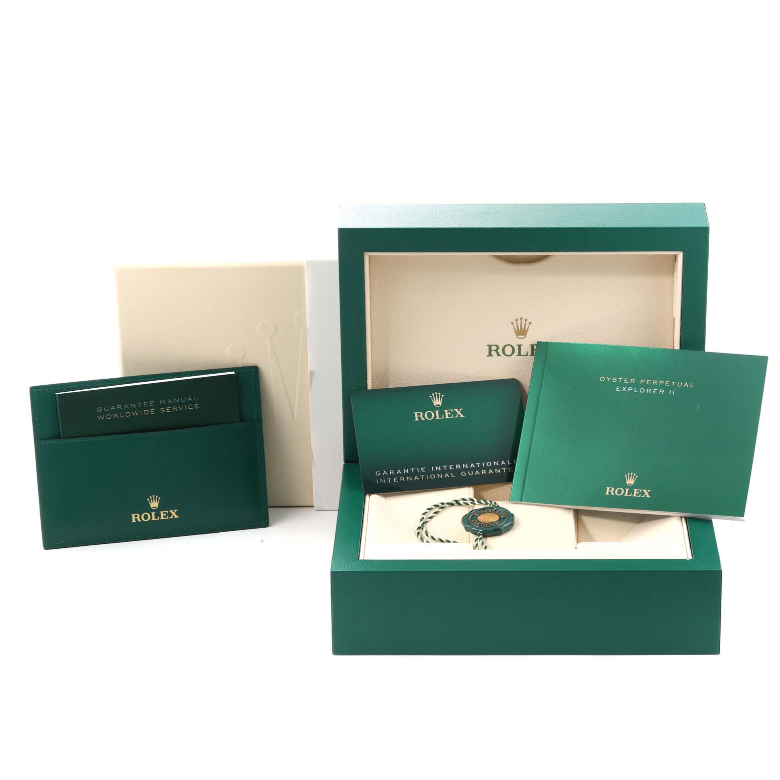 The image shows the packaging, manuals, cardholder, and accessories for a Rolex Explorer 226570 Men
s Stainless Steel White Dial 226570 Men
s Stainless Steel White Dial watch.