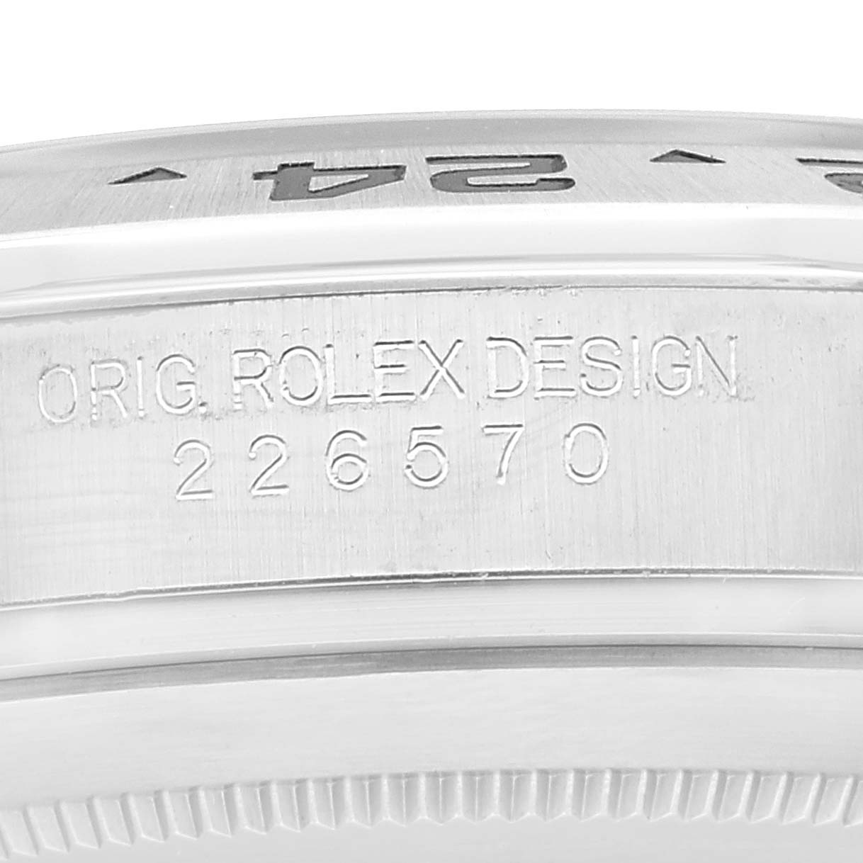 Close-up of the side of a Rolex Explorer 226570 Men
s Stainless Steel White Dial 226570 Men
s Stainless Steel White Dial watch showing the engraved model number "226570" and "ORG. ROLEX DESIGN".