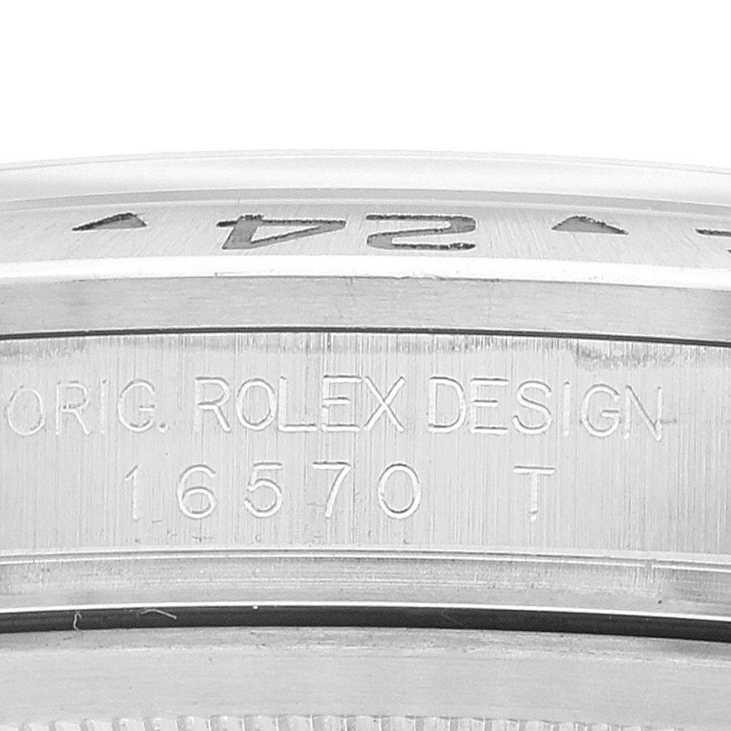 This image shows a close-up of the case side of a Rolex Explorer 16570 Men
s Stainless Steel Black Dial 16570 Men
s Stainless Steel Black Dial watch, displaying the model number "16570" and "ORIG. ROLEX DESIGN" engraving.