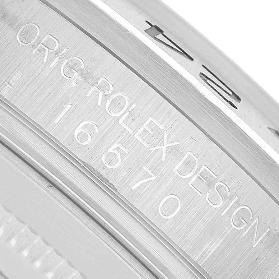 This image shows a close-up of the engraving on the case of a Rolex Explorer 16570 Men's Stainless Steel Black Dial watch.