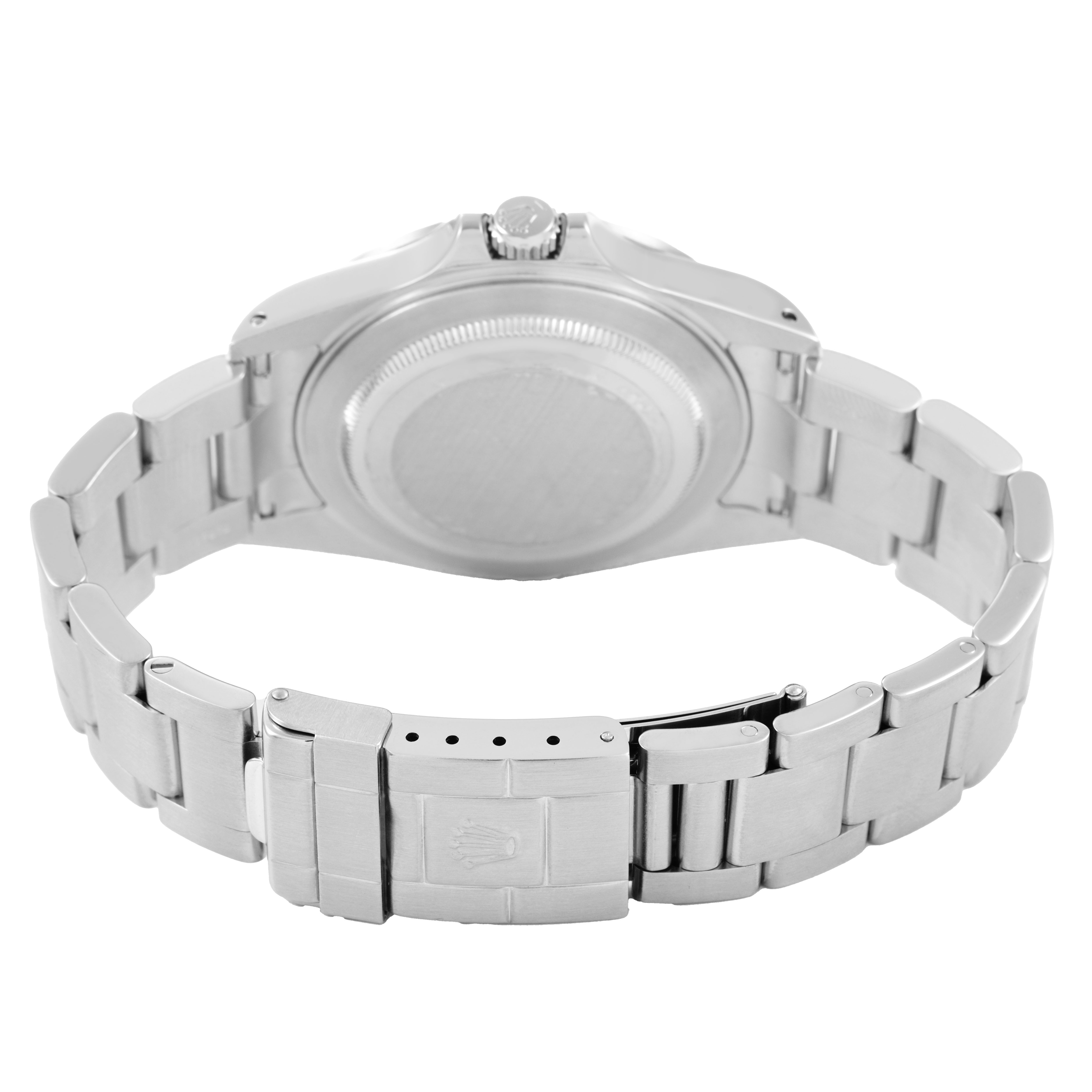 The image shows the back view of a Rolex Explorer 16570 Men's Stainless Steel Black Dial watch, highlighting its clasp, bracelet, and case back.