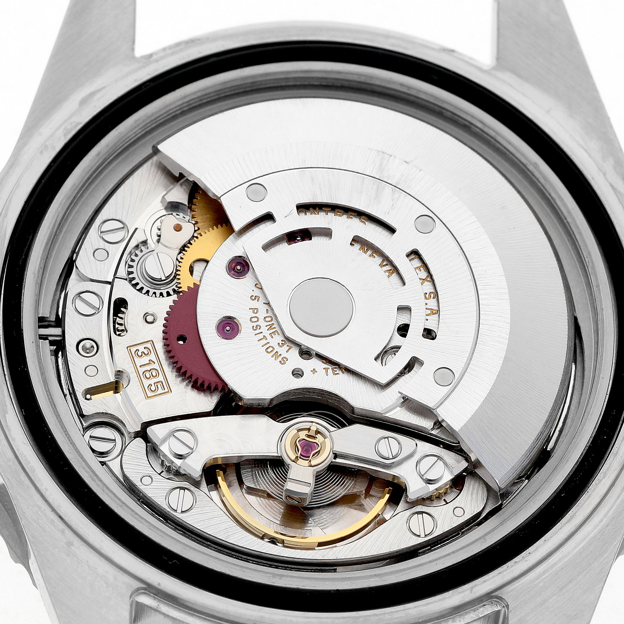 This image shows the movement of the Rolex GMT-Master Men's Stainless Steel Black Dial model from a back view, highlighting its intricate mechanical parts.