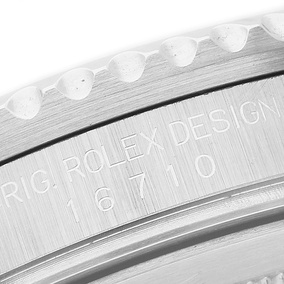 The image shows a close-up of the engraved side of the bezel or case of a Rolex GMT-Master Men's Stainless Steel Black Dial, model 16710.