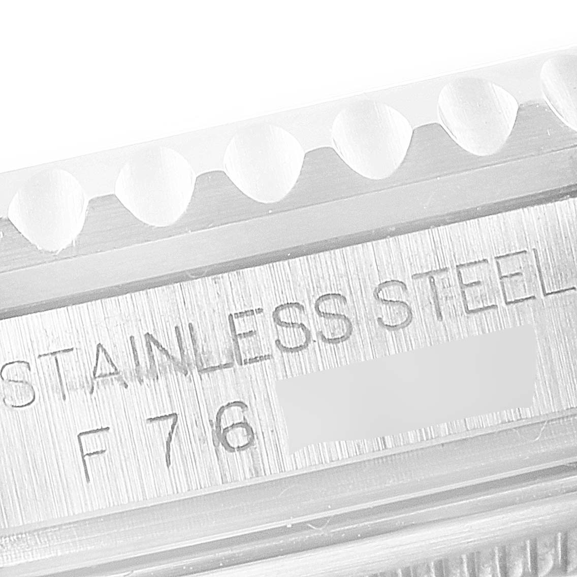 This close-up image shows the engraving on the side of the case of the Rolex GMT-Master 16710 Men
s Stainless Steel Black Dial 16710 Men
s Stainless Steel Black Dial watch, including the material and serial number.