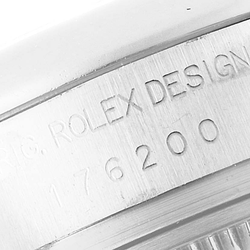 The close-up image shows the inner bezel of a Rolex Oyster Perpetual 176200 Women's Stainless Steel Pink Dial 176200 Women's Stainless Steel Pink Dial watch, displaying the engraved text "ROLEX DESIGN" and the model number.