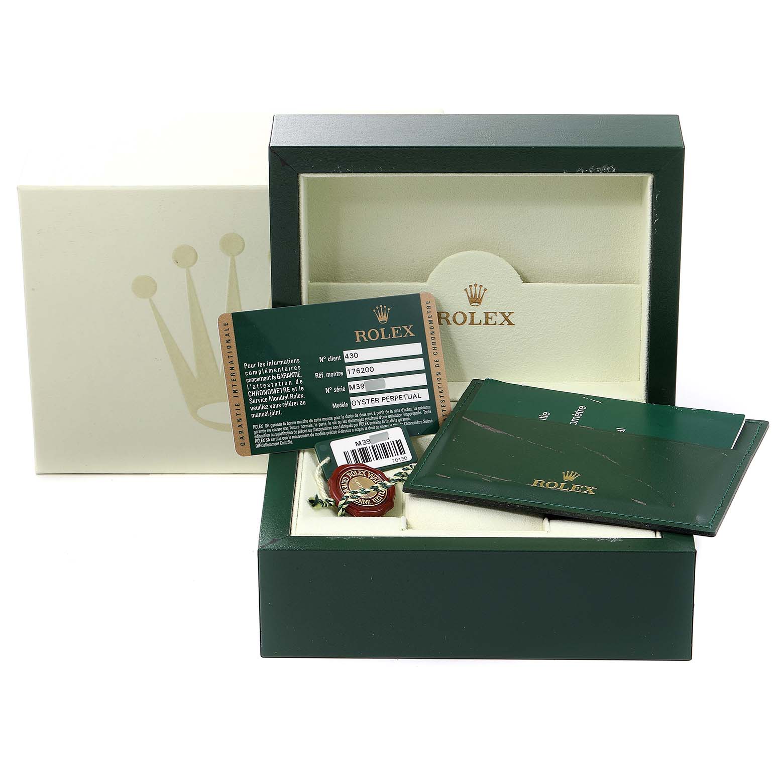 The image shows accessories for a Rolex Oyster Perpetual 176200 Women's Stainless Steel Pink Dial 176200 Women's Stainless Steel Pink Dial, including the box, card, and manual, from a front angle.