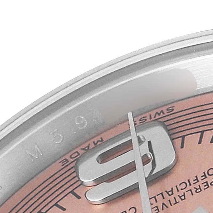This close-up angle shows the dial and part of the bezel of the Rolex Oyster Perpetual 176200 Women's Stainless Steel Pink Dial 176200 Women's Stainless Steel Pink Dial watch.