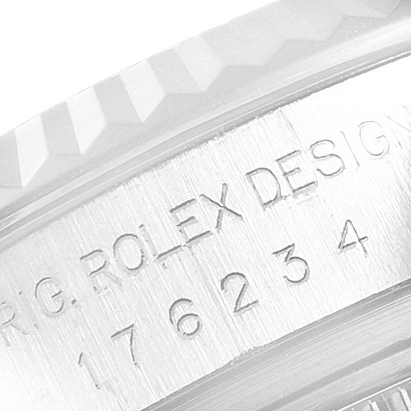 This is a close-up angle of the casing of the Rolex Oyster Perpetual 176234 Women's Stainless Steel Grey Dial 176234 Women's Stainless Steel Grey Dial, showing engraved text and serial numbers.