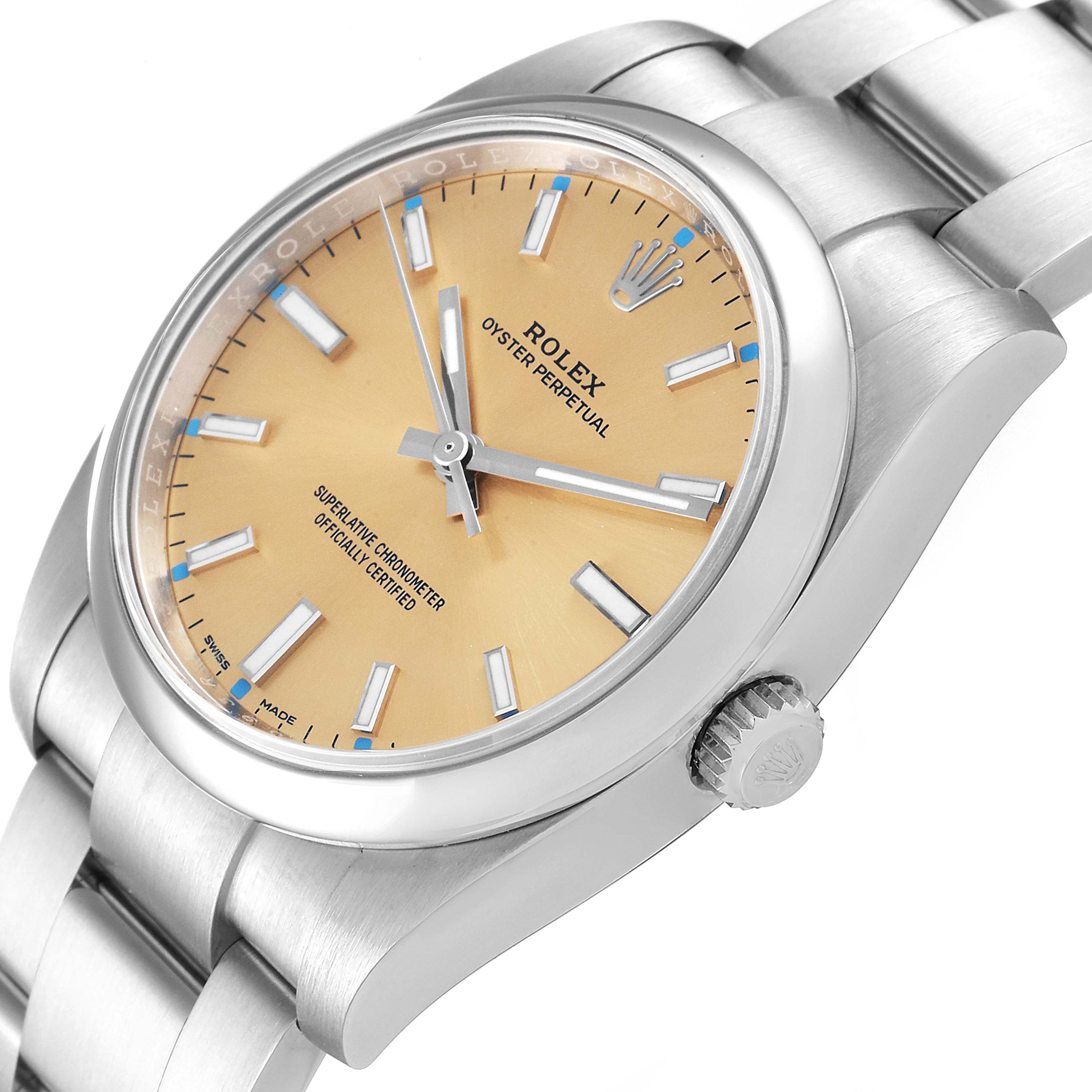 This Rolex Oyster Perpetual 114200 Men's Stainless Steel Champagne Dial 114200 Men's Stainless Steel Champagne Dial watch is shown from an angled top view, highlighting the dial, crown, and bracelet.