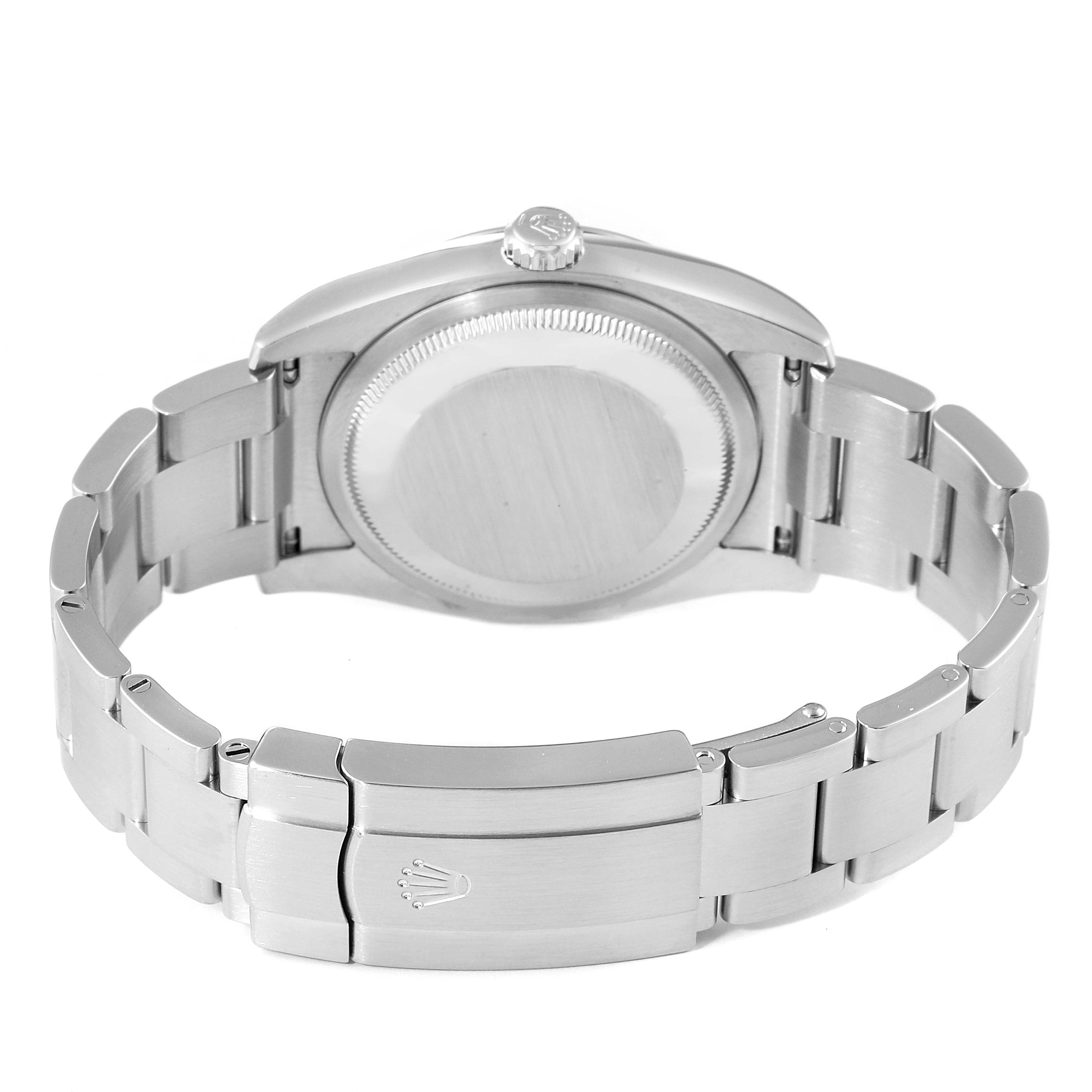 The image shows the back view of a Rolex Oyster Perpetual 116000 Men's Stainless Steel Champagne Dial 116000 Men's Stainless Steel Champagne Dial watch, focusing on the case back and metal bracelet.