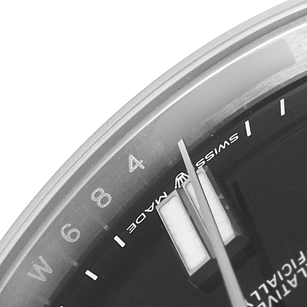 The image shows a close-up of the dial and hands, highlighting the "SWISS MADE" text on the Rolex Oyster Perpetual 124300 Men
s Stainless Steel Black Dial 124300 Men
s Stainless Steel Black Dial watch.