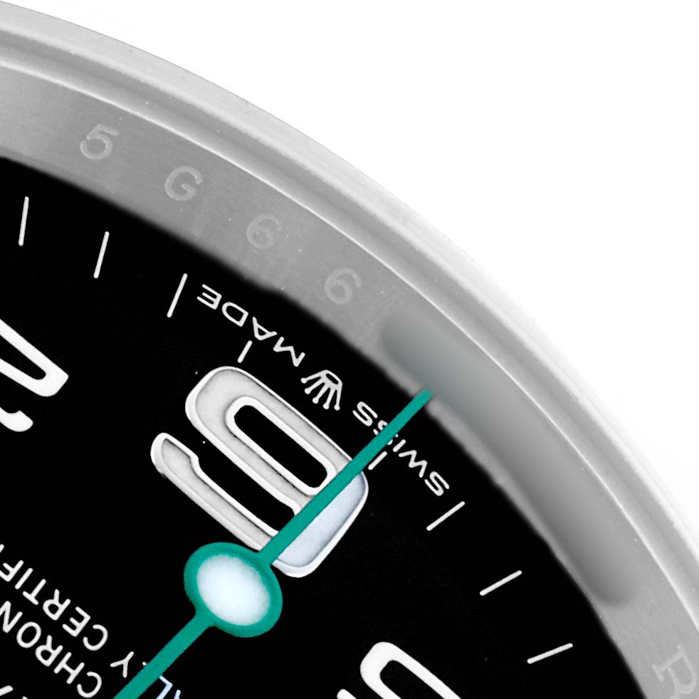 The image shows the edge and part of the dial of a Rolex Air-King 126900 Men
s Stainless Steel Black Dial, highlighting the hour markers and seconds hand.