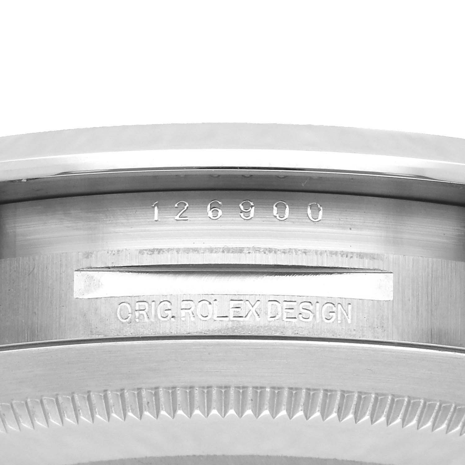 The image shows the side view of the bezel and part of the casing of a Rolex Air-King 126900 Men
s Stainless Steel Black Dial, featuring the model number engraved.