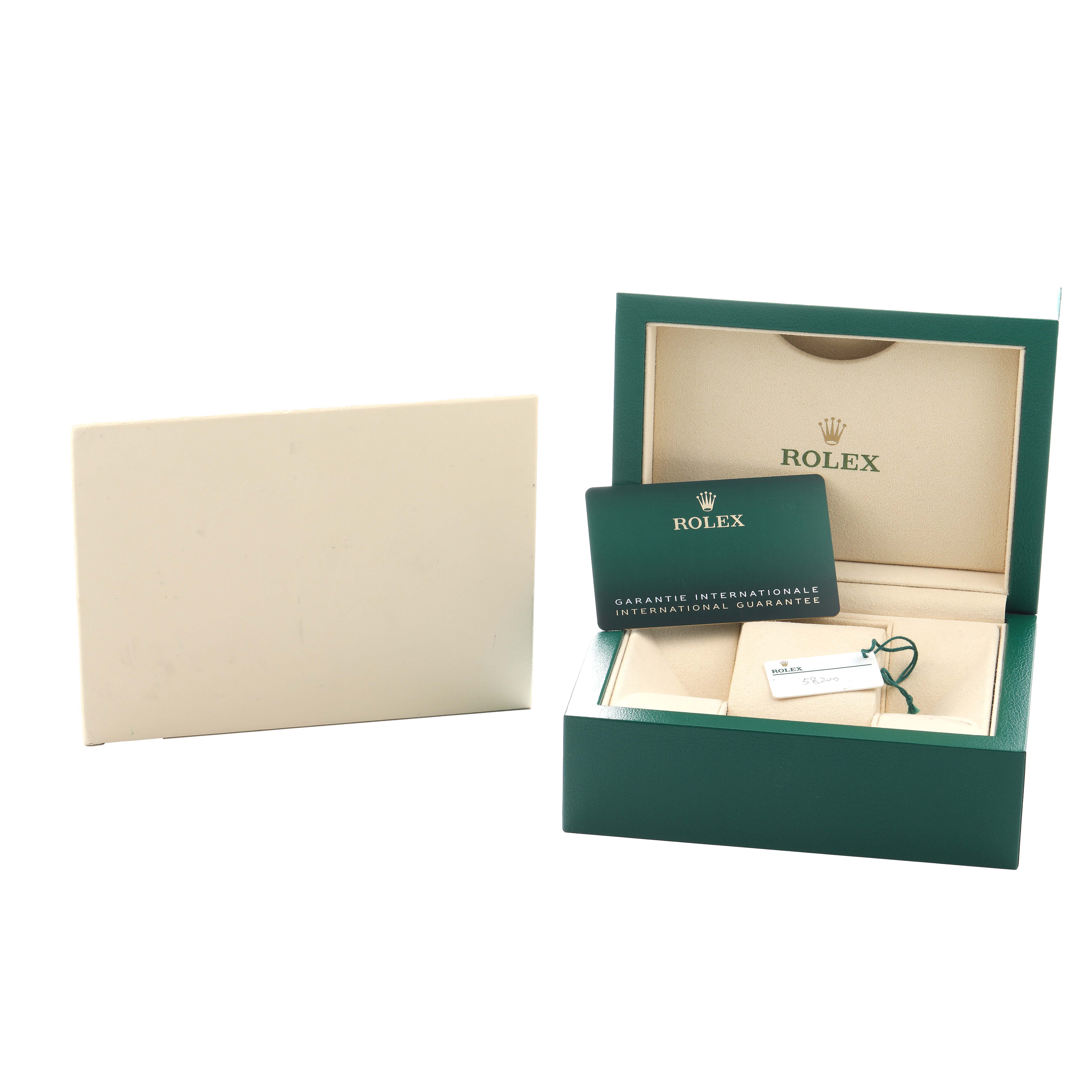 The image shows a Rolex Air-King 126900 Men
s Stainless Steel Black Dial box with guarantee card and tag, viewed from the front.