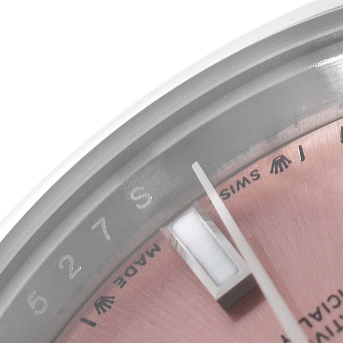 This close-up image of a Rolex Oyster Perpetual 276200 Women
s Stainless Steel Pink Dial 276200 Women
s Stainless Steel Pink Dial watch shows part of the dial, hands, and markers.