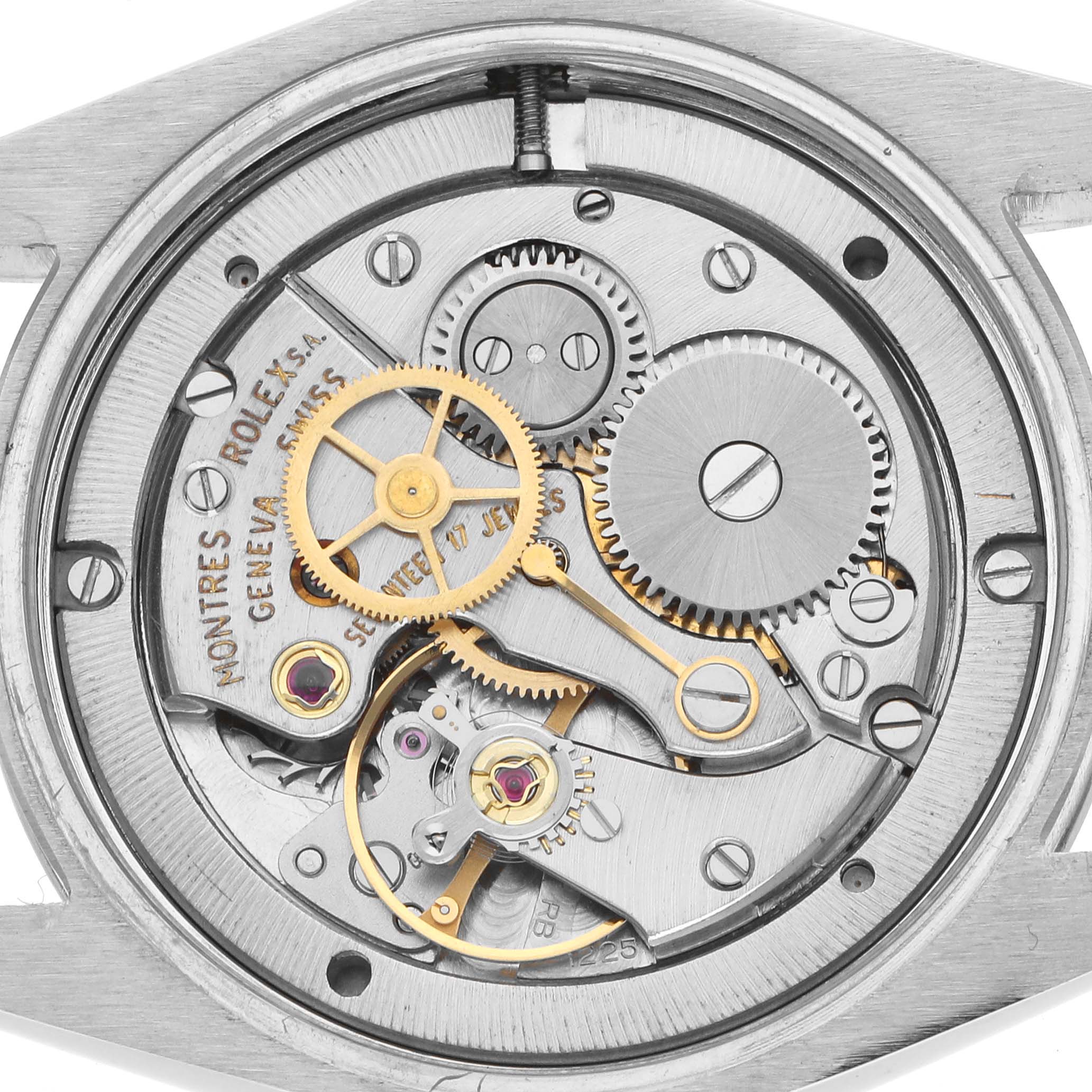 This image shows the inner mechanics of a Rolex Vintage Collection 6694 Men
s Stainless Steel Silver Dial watch, displaying gears and components from a top-down angle.